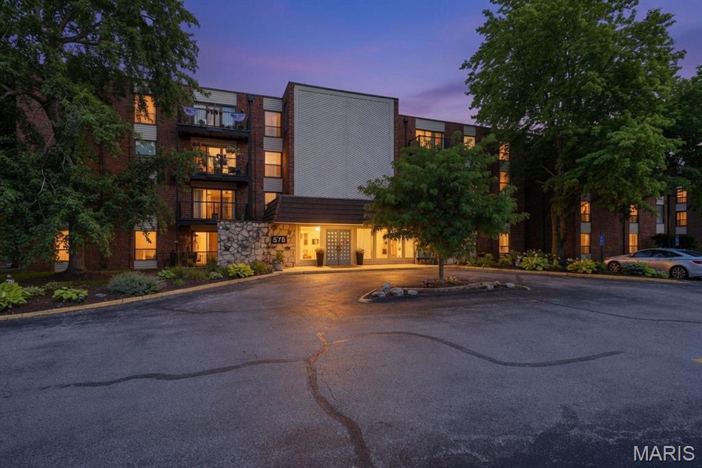 Enjoy outstanding golf course views from the living room, dining room, and both bedrooms in this value-priced two-bedroom, two-bath Golfview condominium, offered as-is and ready for your personal cosmetic updates. Located on the second floor of an elevator building, this unit features in-unit laundry conveniently located in the kitchen. The primary suite offers a walk-in closet and private bath with a separate tub and shower. The hall bath includes a shower. Additional amenities include an assigned garage parking space #14 located directly across from the elevator and a private storage unit #206 in the basement. Excellent opportunity to customize and make it your own.