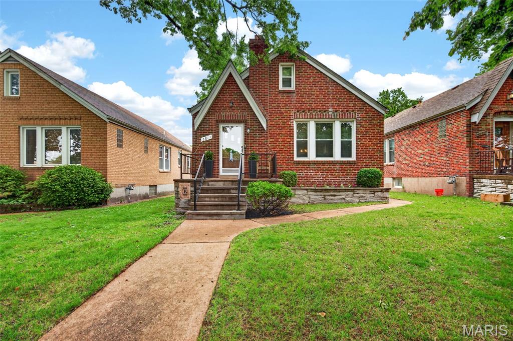 Beautifully updated all-brick bungalow offering the perfect blend of classic South City charm and modern convenience. This move-in ready home features gorgeous hardwood flooring, arched doorways, original millwork, and sun-filled living spaces throughout.

The spacious living and dining rooms create an inviting flow ideal for everyday living and entertaining. The updated kitchen showcases custom cabinetry, stainless steel appliances, sleek backsplash, modern countertops, and center island seating with direct access to the bright enclosed sunroom — the perfect spot to relax with morning coffee or unwind in the evenings.

Generously sized bedrooms provide comfort and flexibility, while the updated bathrooms combine timeless style with modern finishes. The partially finished lower level expands your living space with a large recreation/media area, entertaining space, additional full bath, laundry area, and plenty of storage. Bonus attic space with stair access.

Outside, enjoy a fenced backyard with patio space, detached garage, and mature trees offering added privacy and shade. Conveniently located near parks, restaurants, shopping, and everything South City has to offer, this charming bungalow is one you won’t want to miss.