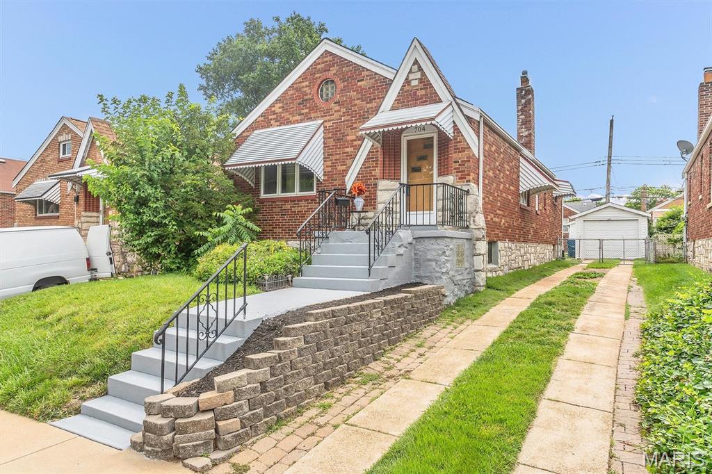 Welcome home to this adorable cottage-style brick home nestled in the heart of Bella Villa! This charming 2-bedroom, 1-bath home is filled with character, natural light, and updates throughout. Step inside to find beautiful hardwood floors, coved ceiling, updated kitchen, fabulous sun room,  elegant cased room openings, white two-panel doors and updated vinyl windows that add to the home's warm and inviting atmosphere.  Cook for 2 or 20 in the beautifully updated kitchen featuring granite countertops, 42" cabinets with crown molding, pull-out shelving, a stylish glass tile backsplash, a deep dual sink and ceramic tile flooring and the refrigerator is negotiable.  Relax year-round in the bright rear sun room or entertain guests on the newer composite deck overlooking the backyard and durable James Hardie siding on the sun porch. Additional highlights include updated lighting and recessed lighting updated PVC plumbing, a walk-up basement offering, ample storage, a detached one-car garage but with room to park 3 additional cars in the driveway, an automatic opener and a fenced yard.  Combining timeless curb appeal with modern updates. This gem is perfect for anyone seeking a comfortable home in a convenient location. Don't miss your opportunity to own this Bella Villa beauty!  The front-load washer and dryer and the security camera system are included in the sale.