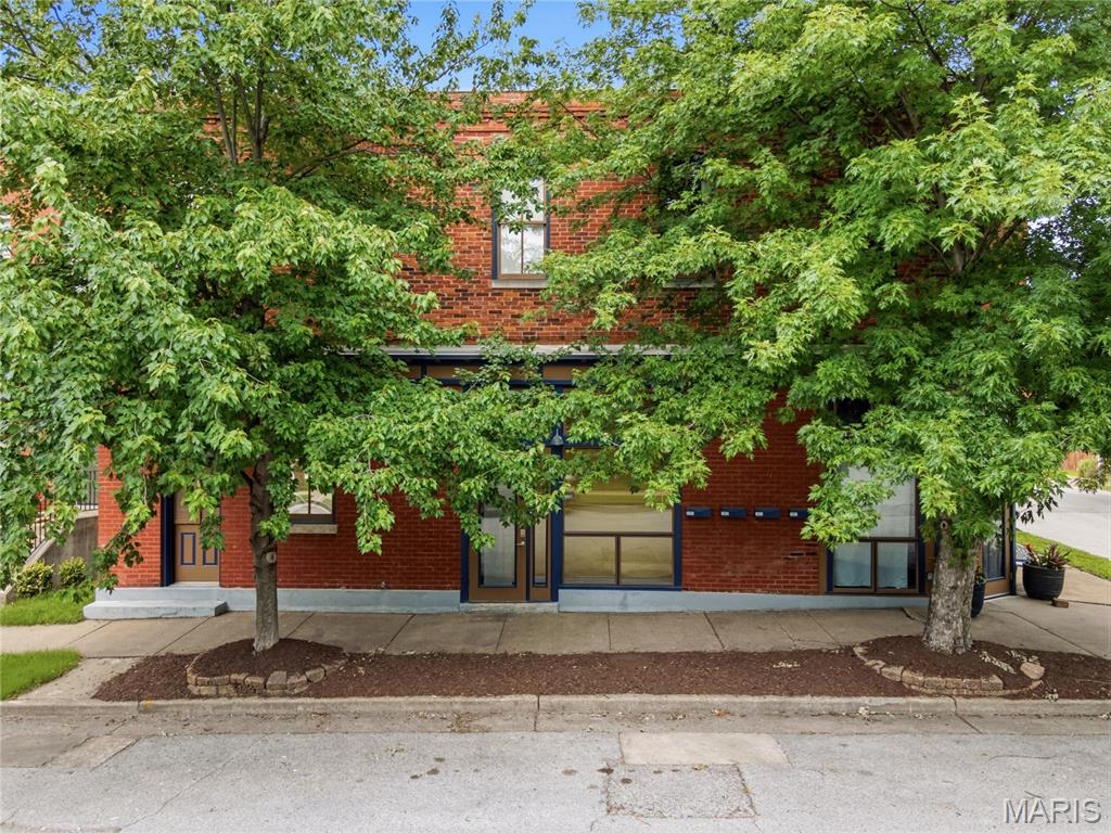 Built in 1884 and beautifully preserved, this Benton Park condo delivers all kinds of character with soaring vaulted ceilings, exposed brick, and hardwood floors that set the stage the moment you walk in.
The open, sun-drenched layout makes everyday living feel effortless, while large windows pull in natural light that makes the space feel larger than its footprint. In-unit laundry, off-street parking, and dedicated storage check the practical boxes without sacrificing an ounce of style.

Step outside and you're in the heart of one of St. Louis's most walkable, vibrant neighborhoods. Blues City Deli, Sidney Street Cafe, Peacemaker, Arzola's all within easy reach. Soulard is practically next door, and Cherokee Street's dining, art, and nightlife scene is right around the corner.  Quick access to I-55 and I-44 makes the rest of the city just as easy.

Whether you're planting roots or adding to your portfolio (rentals permitted), this one checks every box!
