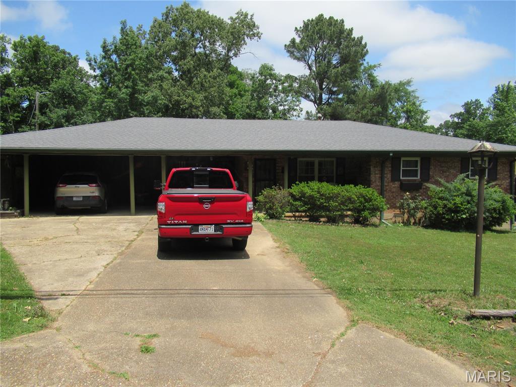 This home is an appealing ranch brick with wood siding on one portion where the family room was added. If you're looking for a roomy and comfortable home
on one level with amenities and located in the heart of the city, look no further. The home is constructed in Seiferts Heights Subdivision and is only a few blocks to Hwy 67 business strip with restaurants, shopping, grocery stores, medical, many other businesses offering different amenities, and includes exits from the city to main highways. The home is priced for sale and is in a range consistent with other properties with good square footage and a large lot to go with it. A must see if you're moving up in square footage living area or buying a first-time home for a growing family. This home is sold "as is".
