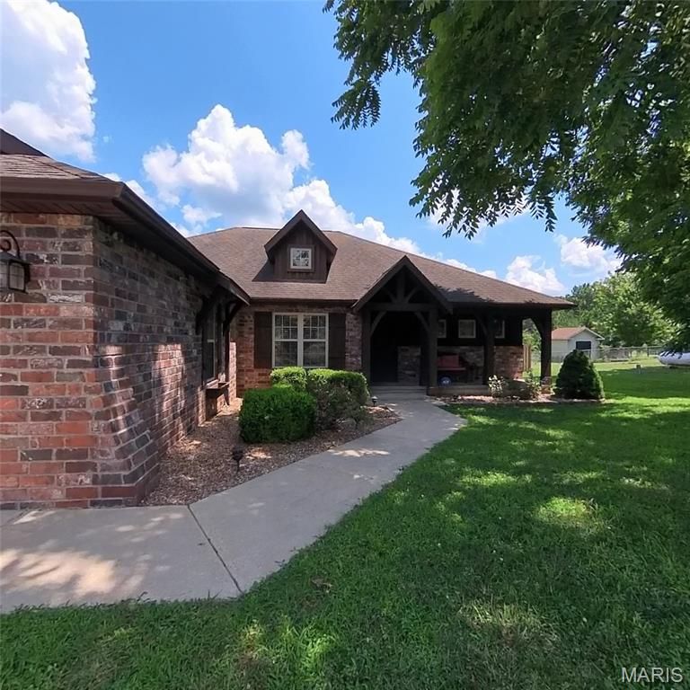Updated Executive Home, located in a quiet subdivision just outside of town. Vaulted Ceilings, Tray Ceilings, High Ceilings and Wood Beam Ceilings are just a few features. Open Concept. CH&A with gas fireplace back-up. Mounted TV stays All the kitchen appliances stay along with the barstools. granite countertops, walk-in pantry. Washer and dryer stay too. Formal Dining. Enclosed SunPorch Screened. Walks out from the Living Room and Primary Bedroom. Large spacious bedrooms. The Primary has a large bath with a Jacuzzi tub, double sinks and a tiled shower. Plus a  walk-in closet with a lots of built-ins. Large Privacy fence, plenty of green grass. Front Covered Porch, two-car attached garage. Seller is paying $6,000 in seller concessions. This home will quality for any kind of financing