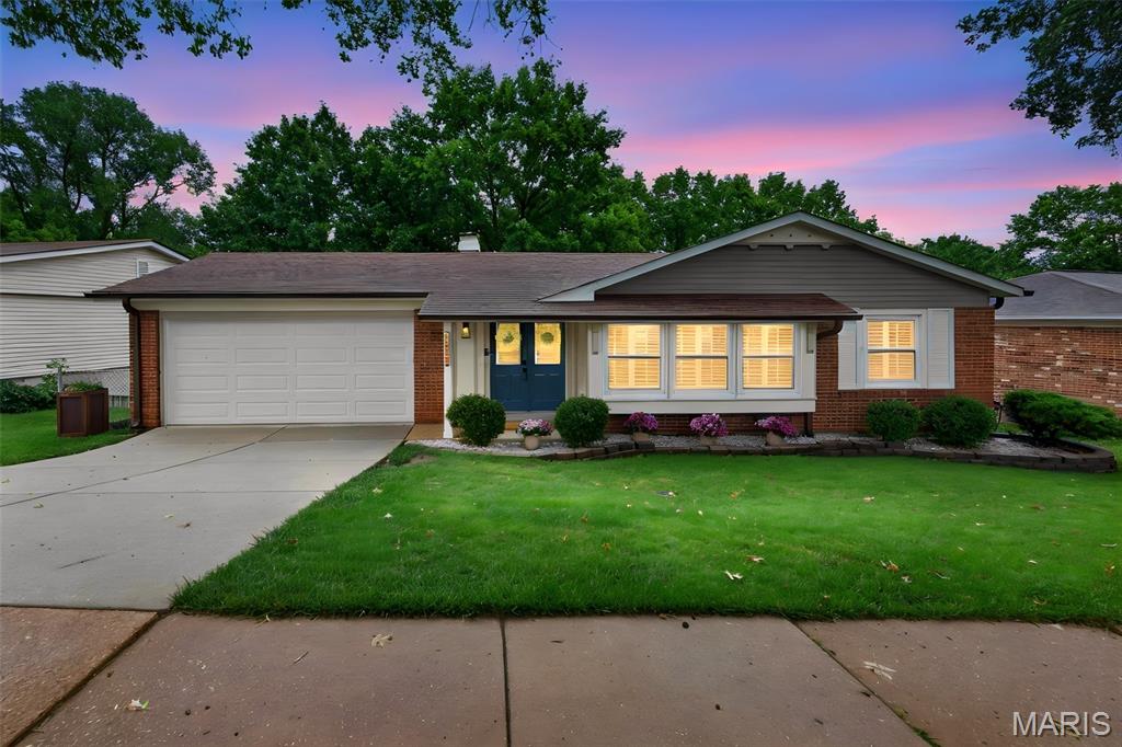 This Oakville ranch is located in a well-established neighborhood with mature trees and a setting that offers a quiet, residential feel. Step inside to a welcoming entry that opens to a spacious floor plan with hardwood flooring and plenty of natural light. The large front window, equipped with plantation shutters and a built-in window seat, adds character and offers a pleasant view of the neighborhood. The kitchen has been updated with granite countertops, stainless steel appliances, and ample workspace for everyday cooking and meal preparation. A separate dining room offers a dedicated area for meals and gatherings, and just off the main living space is an enclosed porch that adds flexible year-round use. From there, step out to an expansive deck overlooking a large backyard with plenty of level space for outdoor activities, gardening, or quiet time outside. The layout was well designed, offering separation between the main living space and bedrooms. The spacious primary suite features a large en-suite bathroom, while the additional bedrooms are generously sized and served by a well-appointed hall bathroom. Downstairs, the fully finished lower level adds an incredible amount of living space with newer carpet, a convenient half bath, and direct walkout access to the backyard patio. Whether you're envisioning a recreation room, home theater, fitness area, playroom, or all of the above, there's plenty of room to make it your own. Additional highlights include a new roof installed in 2019 and an oversized two-car garage with plenty of room for vehicles, storage, and weekend projects and much more. This home combines thoughtful updates, generous living space, and a location that feels welcoming and lasting.