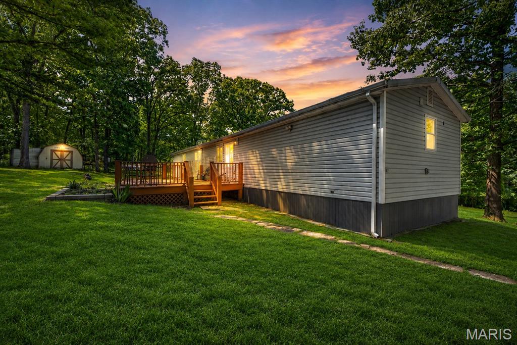 Nestled on 5 acres, this charming home offers the perfect blend of tranquility and functionality. This renovated home has 3 bedrooms and 2 bathrooms. The property features an array of amenities, including a spacious outbuilding equipped with electricity, ideal for storage, or hobbies. A convenient shed provides extra storage space for your outdoor equipment and chicken coup!  Surrounded by scenic countryside, this property offers endless opportunities for outdoor enjoyment and relaxation. Whether you're hosting gatherings, cultivating a garden, or simply soaking in the serene views, this home provides the perfect backdrop for country living.