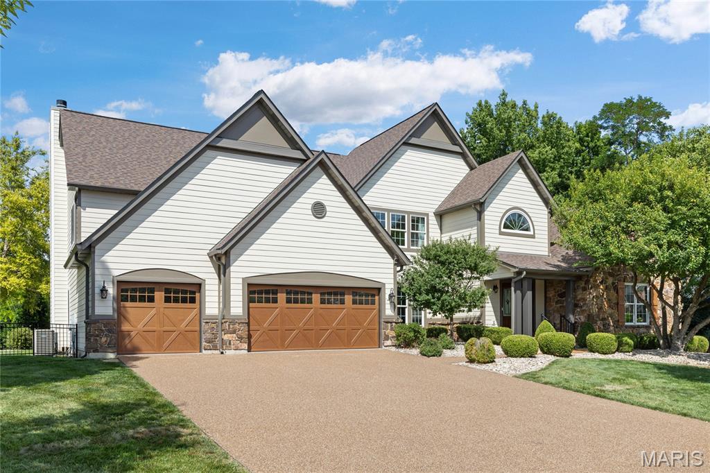 Outstanding Fischer & Frichtel-built 1.5 Sty in desirable Austin Ridge. This former display features an open floor plan with distinctive design elements & builder upgrades throughout including diagonal oak hardwoods, soaring ceilings & detailed trim work. Impressive covered porch entrance with oak double doors with leaded glass panels leads to expansive 2-sty marble foyer, private study with built-in bookcases, formal dining room with arched entryway framed by architectural columns and spectacular great room with marble fireplace, wet bar & dramatic 2-sty bow window. RSI designed kitchen featuring 42” maple cabinetry, quartz countertops, Dacor appliances & center island with dining table adjoins light-filled breakfast room & hearth room with floor-to-ceiling stone fireplace & atrium door that opens to patio. Coffered primary bedroom suite with wide bay window & luxury bath with jetted tub offers an appealing retreat. Oak staircase accesses 3 additional bedrooms, 1 with ensuite bath & 2 with Jack n’ Jill bath, & bonus loft room. Lower Level entertainment space includes recreation room, game room & gathering bar plus office, workout room & guest suite. Situated on an extensively landscaped .5-acre lot with aggregate patio & 3-car garage. Katy Trail is just a short walk or bike ride away.