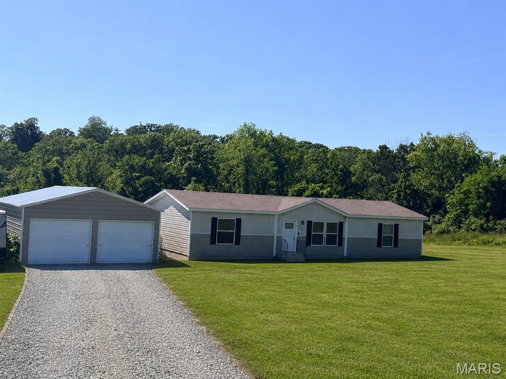 Practically new and move-in ready. This beautiful 3 bed, 2 bath home sitting on 3 acres offers the perfect blend of modern comfort and peaceful country living. Built in 2021 and barely lived in, the home still feels brand new with its inviting open layout, spacious feel, and well-maintained condition. Nestled on a quiet street, you can enjoy the privacy and serenity of rural living.

Outside, the detached 2-car garage provide endless possibilities for vehicles, equipment, hobbies, entertaining, or weekend projects. Whether you’re looking for room to spread out, space to enjoy the outdoors, or simply a quiet place to call home, this property checks all the boxes. Rare opportunity to own acreage with a newer home that is truly move-in ready.