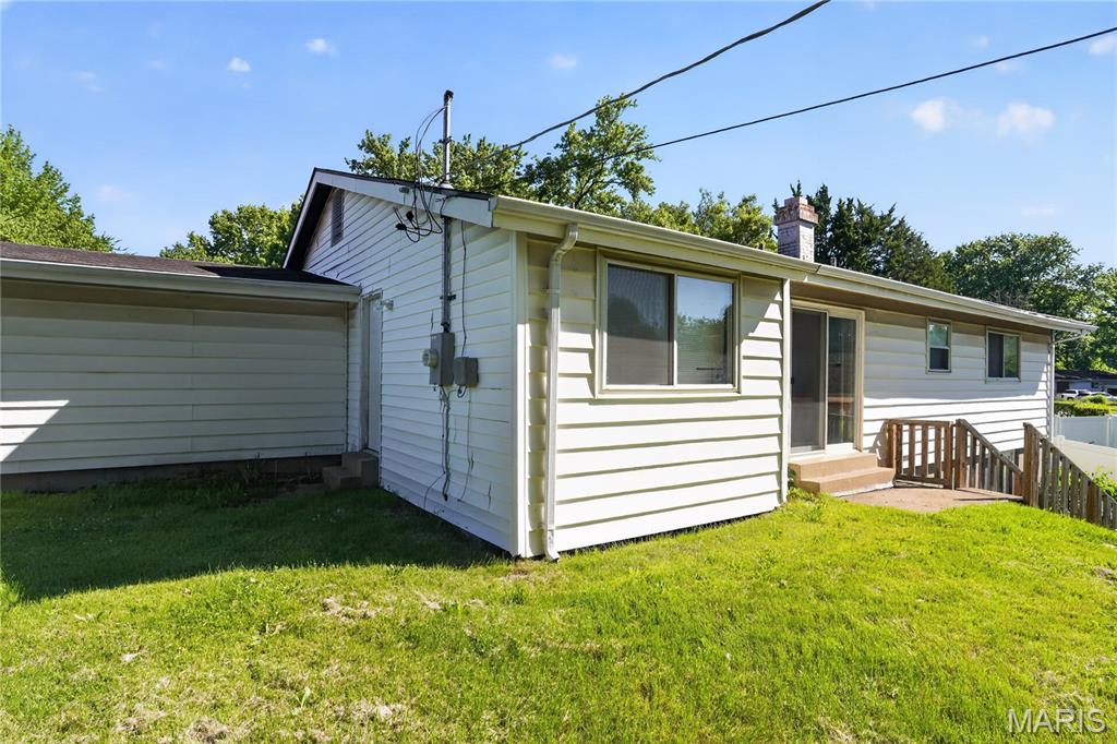 This inviting home features refinished hardwood floors on the main level and a cozy wood-burning fireplace in the family room. Enjoy both formal living and dining rooms, along with a casual dining area in the kitchen—perfect for everyday living and entertaining.

The home offers three bedrooms, 1.5 baths.  A walk-out basement provides additional space and easy access to the outdoors. Step from the family room into a terraced, fenced backyard—ideal for relaxing or hosting gatherings. An attached two-car garage completes this well-appointed property.