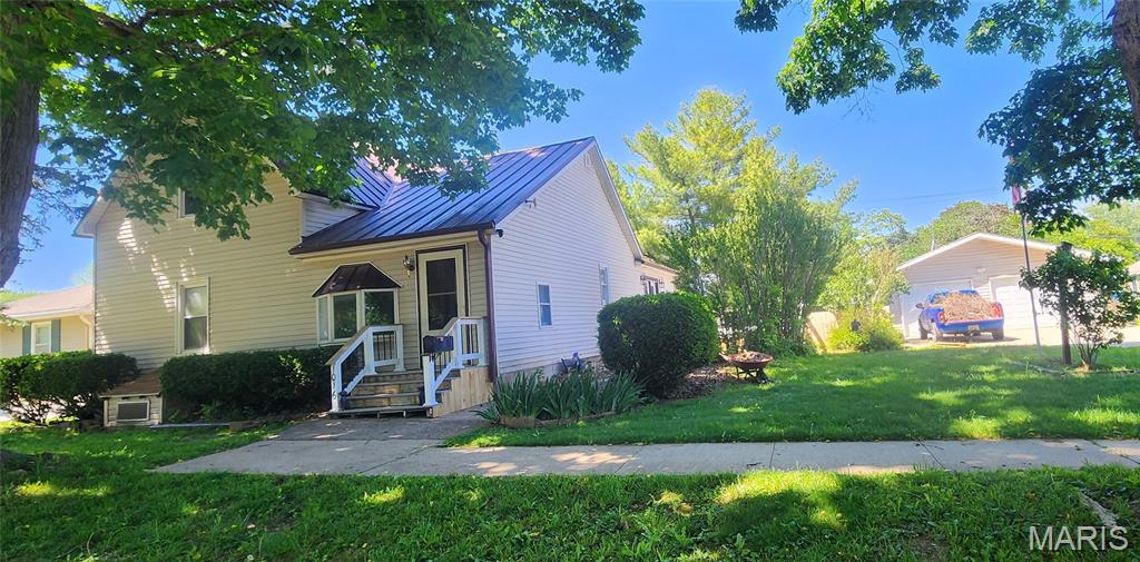 Located in the heart of Canton, this charming 1.5-story home built in 1907 blends timeless character with everyday convenience. Offering 3 bedrooms and 2 bathrooms, the home features a spacious layout with room to make it your own, along with the convenience of main-floor laundry and a partial basement for additional storage. Recent updates include fresh paint throughout the home and new flooring in the second bedroom, providing a clean, updated feel while maintaining the home's classic appeal. The appliances will convey as well.

Situated on a flat lot near local amenities, the property also includes an oversized detached 4-car tandem garage with extra space for hobbies, storage, or a workshop. The garage is equipped with a separate breaker box capable of powering an air compressor, welder, or a 50-amp RV hookup, making it an excellent space for tradespeople, hobbyists, or RV owners. The privacy-fenced backyard is perfect for entertaining, pets, or relaxing evenings, complete with a new composite deck designed for low-maintenance outdoor living.

From the classic charm to the functional updates, this home offers the perfect balance of character, comfort, and practicality.