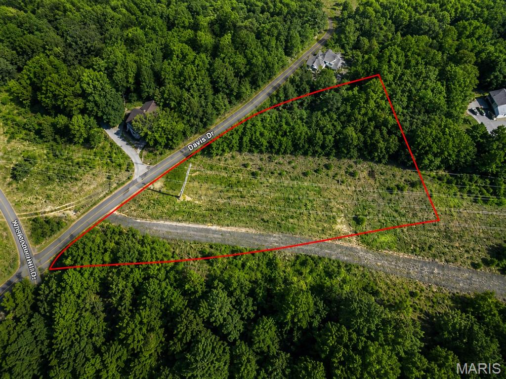 1.8 acre parcel located on Davis Drive in High Ridge, Missouri! Nestled in Jefferson County, this vacant land offers the perfect opportunity for a custom home, weekend retreat, or investment property. Enjoy the privacy of a spacious lot while still being conveniently located near shopping, dining, schools, and easy access to major highways for commuting. Whether you're looking for room to spread out or a peaceful setting surrounded by nature, this property offers endless potential. Bring your vision and make this acreage your own!