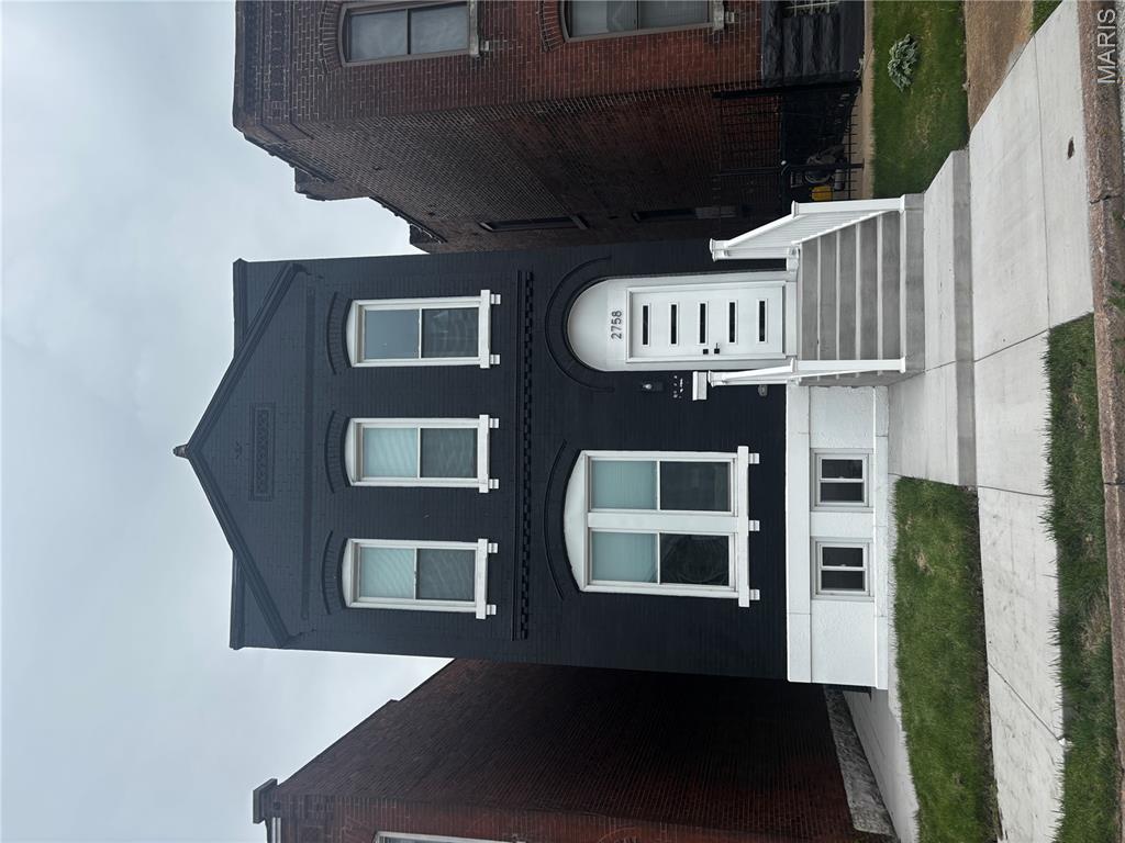 Historic charm meets modern luxury in this fully rehabbed 3 bed, 3 bath home located in the sought-after Gate District of St. Louis. Originally built in 1892, this stunning renovation beautifully blends timeless character with stylish 21st-century updates. The main level features a spacious living room, formal dining area, updated kitchen, and convenient half bath, creating an ideal layout for both everyday living and entertaining. Step outside from the kitchen/dining area onto the large rear deck overlooking the backyard — perfect for gatherings or relaxing evenings. Upstairs, you’ll find 3 generously sized bedrooms and 2 beautifully updated full baths showcasing custom tile work and modern finishes throughout. The primary suite even features its own private deck/balcony, offering a peaceful retreat to unwind. With updated finishes, functional living space, and nothing left to do but move in, this home delivers the perfect combination of historic elegance and modern comfort.
