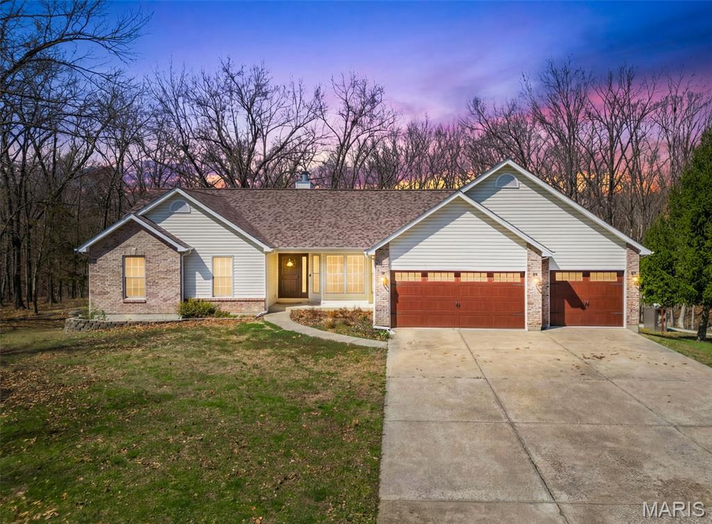 MOTIVATED SELLERS! Go see this one in person! OVER 3800 sq ft of completely reimagined space with nearly all new EVERYTHING! This exceptional property offers the perfect blend of modern luxury and peaceful country living on 10 private acres with walking trails, a natural spring and MORE. Thoughtfully updated throughout, this move-in-ready retreat showcases high-end design, including a gourmet kitchen with cambria countertops upstairs, silestone countertops downstairs, stainless steel appliances (both kitchens), custom cabinetry, and designer lighting. The main level features stunning luxury vinyl floors, abundant natural light, bay windows, a wood-burning fireplace, and a spacious primary suite with coffered ceilings and a spa-inspired bath with double sinks and an oversized Onyx walk-in shower. The finished lower level provides two additional bedrooms, a full bath with massive secondary onyx accessible walk in shower, living area, and a SECOND fully equipped high end kitchen as well as walk-out access—ideal for multi-generational living or income potential. Washer & dryer hookups on both levels! Enjoy the serene wooded trails, a large covered cedar deck overlooking nature, a massive, finished 3 car insulated attached garage w/ epoxy floors as well as in the versatile 2000+ Sq ft pole barn with a unique “Eagle’s Nest” loft space heated/cooled for recreation. An additional outbuilding is perfect for storage. A rare opportunity to own a private, turnkey estate with endless money making possibilities. A MUST SEE IN PERSON PROPERTY! Roof 2020, well wiring/pump 2021, gutters 2022, basement windows 2023…so much more! Hunt, build a lake, put in a pool, make it a shooting range, bed and breakfast, VRBO, food truck venue, ect. ENDLESS POSSIBILITIES, Schedule a tour today! 
** An additional 10 acres is also available for purchase with proper offer.