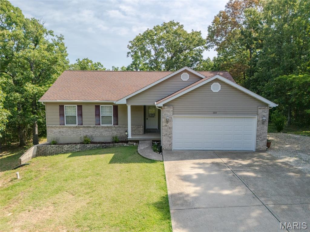 PRIVATE WOODED RETREAT in the GATED LAKE COMMUNITY of Summerset Lake! This MOVE-IN ready ranch offers the lake lifestyle you've been dreaming of.  This 3-bedroom, 2-bath creates a warm and inviting feel from the moment you walk in, with gorgeous wood floors, soaring vaulted ceilings, and a cozy fireplace that anchors the spacious living room.  The kitchen is full of rustic charm, featuring slate tile flooring, a coordinating slate backsplash, and plenty of space to gather, with stainless appliances and pantry! Step directly onto the deck and enjoy your own private outdoor retreat surrounded by mature trees—perfect for entertaining or simply unwinding after a long day. The spacious primary suite offers dual closets and a private ensuite bath, complete with a separate soaking tub and shower, creating the perfect place to relax. Two additional bedrooms and a second full bath complete the main level. The partially finished WALK-OUT lower level provides flexible living space with endless possibilities for a fourth bedroom, family room, rec room, home office, or workout area. A ROUGH-IN is already in place, making future expansion even easier.  Additional features include a newer furnace and air-conditioning, an attached garage, and a storage shed for all your outdoor equipment.  This gated lake community offers access to multiple lakes for fishing, boating, kayaking, and swimming, along with a sandy beach, boat ramps, campground, playground, picnic areas, and a peaceful setting surrounded by nature. Conveniently located just a short drive into downtown Desoto for shopping and under an hour from downtown STL.  Summerset Lake offers the perfect balance of everyday living and weekend getaway vibes. Whether you're relaxing on the water, enjoying community amenities, or taking in the tranquil surroundings, you'll love calling this special community home.