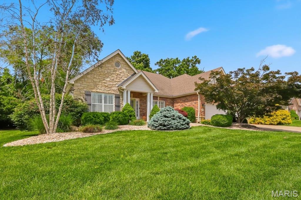 Rare opportunity to own a stunning, move-in ready ranch home in the highly sought-after Hidden Creek 2 subdivision! Boasting nearly 4,200 sq ft of beautifully finished living space, this pristine 3-bedroom, 3.5-bath property perfectly blends elegance and everyday convenience. Step inside to an inviting, divided-bedroom floor plan highlighted by gorgeous hardwood floors, custom built-ins, a gas fireplace, and sophisticated millwork, including crown molding and wainscoting. The gourmet kitchen features premium staggered cabinetry with under-cabinet lighting, flowing effortlessly into the bright breakfast room with a door to the covered patio. Unwind in the main-floor primary ensuite, complete with a private luxury bath (separate tub/shower) and a custom walk-in closet.

Downstairs, the massive finished basement/lower level functions as an incredible extension of the home, featuring a spacious family room, a second cozy gas fireplace, a full bath, and a flexible bonus room perfect for a home office, gym, or guest space. 

Step outside to your private oasis—a beautiful covered patio that backs to a serene, wooded lot/mature trees. Enjoy peaceful moments overlooking the lush, landscaped yard. Additional premium upgrades include a main-floor laundry room, a 3-car garage, a full in-ground sprinkler system (front and back), and a newer 50 gallon water heater. Located in the top-rated Francis Howell School District and just minutes from local shopping, dining, and parks. Schedule your tour today!