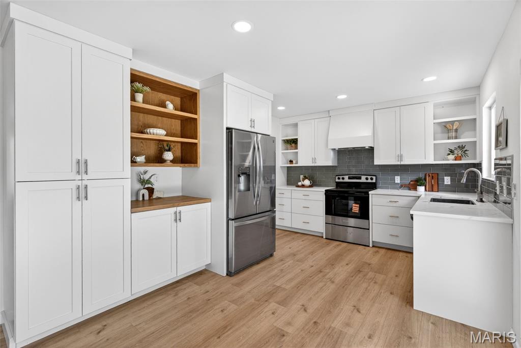 This is the one you've been waiting for! Welcome to this beautifully updated 3-bedroom, 2-bath brick home nestled in a quiet neighborhood in the highly acclaimed Lindbergh School District. Thoughtfully designed with an open and airy floor plan, this exceptional home blends modern finishes with comfortable living spaces ideal for both everyday living and effortless entertaining.

Luxury vinyl plank flooring flows throughout the main living areas, creating a stylish and cohesive modern look. The stunning kitchen opens seamlessly to the living and dining areas and is appointed with new stainless steel appliances, gleaming quartz countertops, and an abundance of custom built, slow-close, cabinetry. The new vinyl windows and sliding door with inset blinds let in a ton of natural light and overlook the massive back yard! 

The serene primary suite offers a private retreat featuring a full ensuite bath, renovated with a ceramic tile shower (with a built-in niche & new glass door), a beautiful new vanity and a generously sized primary closet. The finished lower level expands the living space with a substantial family room anchored by a charming wood-burning fireplace, creating the perfect setting for relaxing evenings or gatherings with family and friends. An additional finished storage room provides excellent organizational space and is the perfect laundry/mud room, right off of the oversized 2 car garage. 

Step outside to the inviting patio and enjoy a park-like backyard with ample room for gardening, outdoor entertaining, or simply unwinding in the fresh air. You will absolutely love the private, level & almost fully fenced back yard. This oversized lot is over 1/4 acre, a rare and desirable find in this incredibly convenient Crestwood location! The storage shed offers convenient space for gardening tools and equipment.

Combining tasteful updates, versatile living spaces, and an outstanding location in one of the area’s most desirable school districts, this remarkable home is truly a must-see. Stop by our open house to check this stunning home out! You're going to LOVE it!