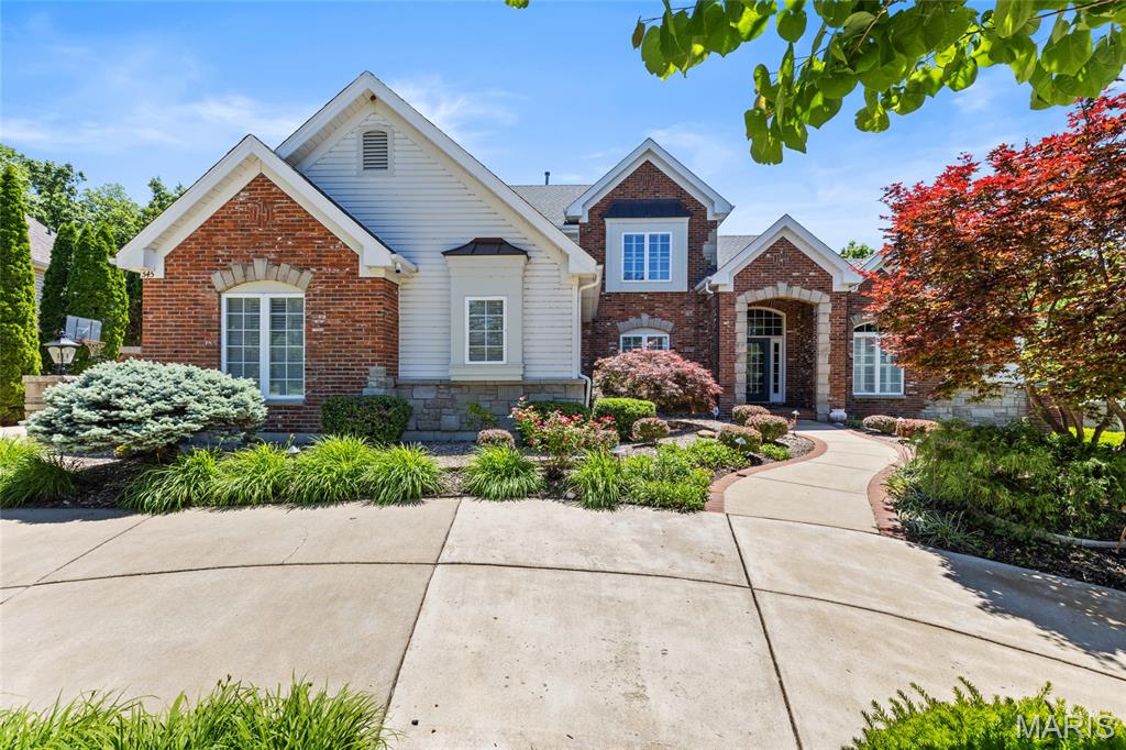 Immaculate Executive Style 1.5 Story Estate  with over 5000 sq ft of living space and Salt Water Pool, Overlooking the Par 5 14th Fairway of Lake Forest Country Club Golf Course all while on a private Cul De Sac! Walking up to your residence you will notice the beautiful landscaping and paved walk way leading to your covered brick entry way. Entering the residence through  foyer you will be wowed by the immediate views of the Golf Course and your backyard pool oasis through the stunning floor to ceiling windows of the great room. Nearly the entire main floor living areas offer new high end hardwood flooring (Dining, Office, and Great Room) and refinished hardwood (Kitchen, Breakfast room, Hearth Room) Besides the view, as you enter you will notice a formal office/sitting room to your right and formal dining space to the left. The great room has a twelve foot ceiling, a wall of windows and gas fireplace. Off the Great room you will pass by the floor to ceiling milled book cases and find a sprawling kitchen with high end appliances (newer Refrigerator and Microwave), upgraded cabinets, stone work, large island, walk in pantry, planning desk and tucked away powder room. Off the kitchen you will find a Breakfast room, large hearth room with a vaulted ceilng, a gas fireplace, a wall of windows over looking mature trees and the golf course. A sprawling screened porch with access to your deck with a natural gas connection for convenient grilling is off the breakfast room. Large main floor mudroom/laundry room is adjacent to kitchen as well. Across from the laundry room there are three spacious cubbies perfect for coats and backpacks with built-in benches for putting on your shoes.  Your main floor primary suite upgraded (2026) to meet the desires and comforts of the most particular homeowners. Feel like your on vacation everyday with the new full tile shower with glass shower doors, rain shower head, new stand alone tub, new vanities, lights, faucets, and toilet. The primary also continues with the great views of your pool, golf course, and coffered trey ceiling and large walk in closet. Before venturing upstairs, please note that the seller has replaced 36 windows between 2022 and 2024 a tens of thousands of dollars investment. Also note the new Door Handles and Hardware throughout the main and upper floors and all six entry doors. Upstairs you will find 3 additional bedrooms all generous in size with walkin closets. One of the bedrooms is a true en suite with private bath, while the other 2 bedrooms share a shower, but have private vanities! A rare find in any residence. Your walk out lower level is a true extension of your home with large family room with wood burning fireplace, bar, pool table space, theater area, separate workout room, and 4th full bath with direct access to the pool. Your walk out basement leads to your stunning salt water pool and patio area for relaxing or entertaining overlookig the golf course. Your Salt water pool offers a new Salt Cell (2025) New Liner (2022) and a newer winter cover as well. This residence offers a newer roof, Gutters, Downspots, Fascia, and Copper Awning, Flashing and Valley. You also have a Dual Zoned System for your families Comfort. If all of this is not enough, your home is completed with a large circle driveway and over sized 3 car side entry garage. This home is located within the boundaries of the Lake St. Louis Community Association allowing you access to Lake St. Louis, Lake Louise, a wonderful clubhouse and many incredible amenities.