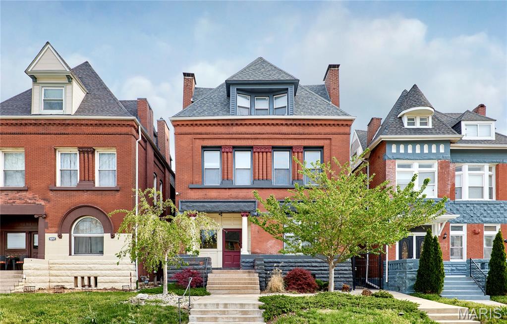 Beautifully renovated 3-bedroom, 2-bath condominium offering 1,586 sq ft of living space in a historic 1891 brick building. This light-filled home features an open floor plan, polished concrete floors, recessed lighting, oversized windows, and smart home technology throughout. The spacious kitchen boasts a large center island, granite countertops, stainless steel appliances, gas range, abundant cabinetry, and generous prep space. The primary suite features a spa-inspired bath with a large soaking tub and designer tile, while the second full bath offers a double vanity and oversized soaking tub. Additional highlights include a large walk-in closet, in-unit laundry, private deck, rear carport parking, and an unbeatable location just minutes from Forest Park, BJC, Washington University Medical Center, shopping, dining, and major highways.