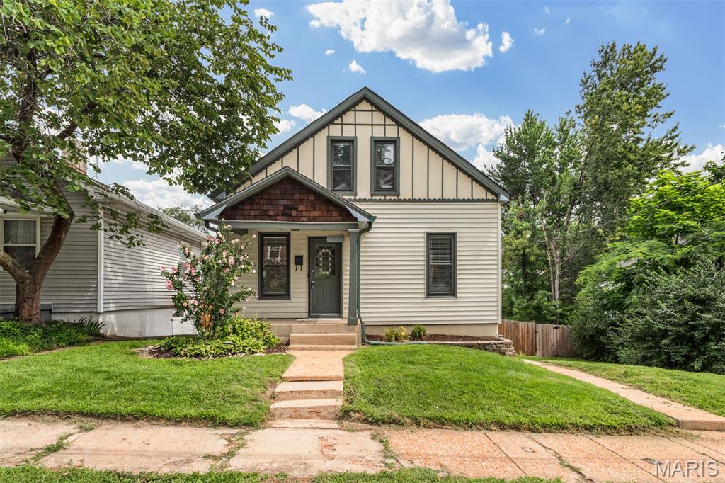 Charming Dogtown cottage on a Double Lot! Updated 3-bed, 2-full bath home with great flow and modern finishes. Main floor features a cozy den, plus a bedroom and an updated full bathroom. The kitchen — the home's standout — is fully renovated with a center island, quartz countertops, and opens to the dining area with direct access to the deck. Upstairs offers a primary bedroom, a third bedroom, and another full bathroom.
The walk-out basement includes laundry and direct access to a patio/fire-pit area. Large backyard with a new privacy fence (2024) and off-street parking on a driveway. Other recent seller improvements include: whole house professionally painted (June 2026), new carpet upstairs (June 2026), new AC (2025), reinforced fence and removed all trees due to tornado damage (2025), Backyard retaining wall (2025), Updated kitchen (2021), replaced and expanded back deck (2018). Convenient Dogtown location with easy highway access, popular bars and restaurants, and walkable to Forest Park. An ideal blend of style, comfort and location—this Dogtown charmer offers effortless city living!