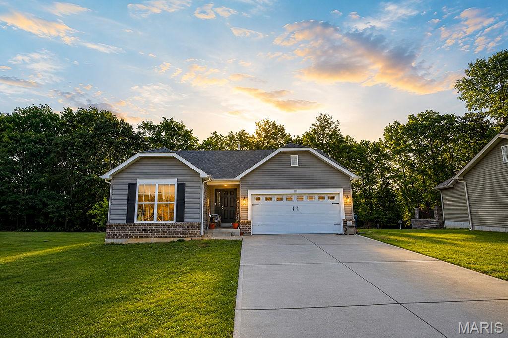 Welcome to 1192 Tahoe Place in Pacific, Missouri, a beautifully maintained ranch home that perfectly blends comfort, functionality, and style. Situated on a quiet lot backing to mature trees, this home offers a peaceful setting with exceptional privacy and outdoor enjoyment. Inside, you'll find a bright and inviting floor plan with spacious living areas, generously sized bedrooms, and tasteful finishes throughout. The true showstopper is the finished lower level, which adds substantial living space and versatility, featuring a large recreation area, family room, custom coffee bar, full bathroom, fitness area, and dedicated play space—ideal for entertaining, working from home, or accommodating a growing family. The wooded backyard provides a scenic backdrop for relaxing evenings, gatherings with friends, or watching children play. An attached two-car garage, excellent curb appeal, and convenient access to schools, shopping, dining, and Interstate 44 make this property an outstanding opportunity. Offering the perfect combination of move-in-ready convenience and flexible living space, 1192 Tahoe Place is ready to welcome its next owners home. Available for showings starting 6/18/2026