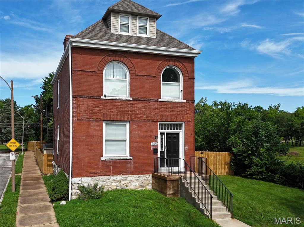 Welcome to 1829 Avenue. a beautiful updated three-story brick home nested on a quiet cul-de-sac in the heart of Fox Park. Offering over 2,600 square feet of living space. this spacious resident seamlessly blends historic character with modern updates. Step inside to find an open and inviting main level featuring expansive living and dining space, updated flooring and stylish kitchen complete with granite countertops. stainless-steel appliances, abundant cabinetry, a sunny breakfast area overlooking the back yard.  A convenient half bath completed the main floor.  

Second level features a versatile office or flex space and an impressing primary suite with a custom walk in closet and luxurious spa- inspired bathroom.  Third floor provided two additional generously sized bedrooms and full bath, offering plenty of room for family, guest, or work from home needs. Located just minutes from SLU, Lafayette Park & Tower grove, major highways, dining and entertainment, this home delivers the perfect combination of space, styles, and location and additional fenced lot that could easily accommodate a garage -but you might just want to enjoy your green space!