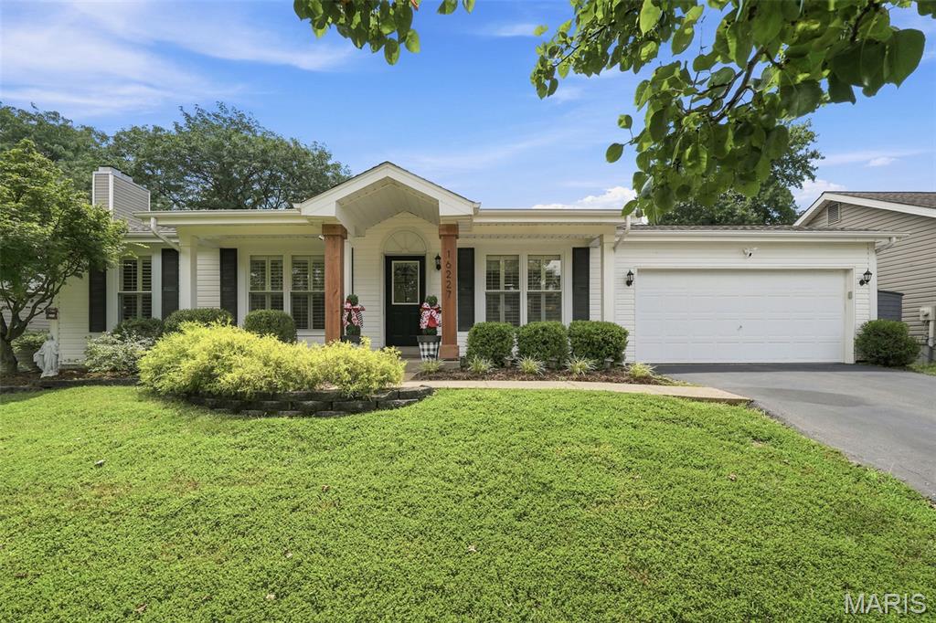 Welcome to 16227 Castlerea Drive in sought-after Tartan Green! This beautifully updated 3-bedroom, 2-bath ranch offers the perfect blend of style, comfort, and functionality in the award-winning Rockwood School District. Gorgeous hardwood floors flow throughout the main living areas, where an open-concept layout creates an inviting space for everyday living and entertaining. The stunning family room features a designer-inspired shiplap accent wall with an electric fireplace and abundant recessed lighting.  The updated kitchen is sure to impress with white cabinetry, solid surface countertops, subway tile backsplash, stainless steel appliances, and serves as the heart of the home. The spacious primary suite offers a private bath, while two additional bedrooms and an updated hall bath complete the main level.  The finished lower level provides additional living space ideal for a recreation room, home office, workout area, or playroom and plenty of storage.  Step outside to enjoy the fully fenced backyard featuring a pergola-covered patio, garden beds, and plenty of room for entertaining, pets, and play. Conveniently located near parks, shopping, dining, and major highways, this move-in-ready home offers exceptional value. Don't miss your opportunity to call this your home!