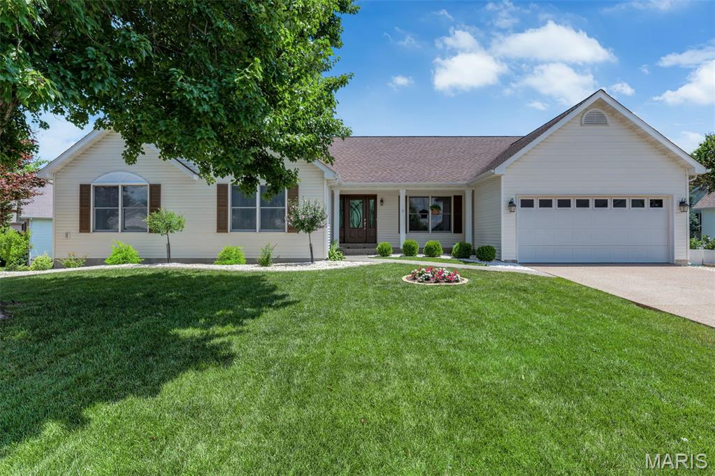 METICULOUSLY MAINTAINED and loaded with updates! This gorgeous ranch-style home offers an exceptional floor plan with quality features throughout. The beautifully updated kitchen is the heart of the home and features Cambria quartz countertops, tile backsplash, stainless steel appliances, a large center island, huge walk-in pantry, updated lighting, and abundant custom cabinetry. The spacious vaulted great room is perfect for gathering and flows seamlessly into the formal dining room. Retreat to the impressive primary suite featuring a luxury bath with double vanities, separate soaking tub and shower, and a large walk-in closet. The secondary bedrooms are generously sized, and the convenient main-floor laundry adds everyday functionality. The finished walkout lower level is an entertainer's dream with a large family room featuring a gas fireplace, wet bar, spacious fourth bedroom, full bath, and an additional flex room ideal for a home office, hobby room, workout space, or playroom. Step outside to enjoy the maintenance-free deck with lighting, professionally maintained sprinkler system, updated landscaping, terracing, and additional storage provided by the Tough Shed. Major updates include HVAC, Renewal by Andersen doors, sump pump with battery backup, kitchen updates, and more. Lovingly cared for and truly move-in ready, this spectacular home offers quality, space, and value throughout. This is a must-see!