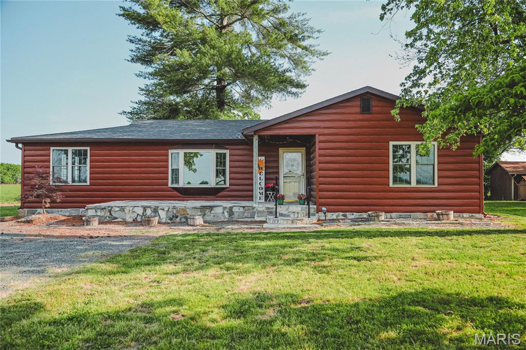 Perfect country setting to enjoy each sunrise and sunset! Ranch two bedroom (could be three by making the family room a bedroom), one bathroom, family room, open concept kitchen, living room & dining. Most everything updated in 2020. Living room features a stone fireplace with gas log. Kitchen with stainless appliances including double oven gas stove with vent and pot filler, refrigerator & dishwasher. Quartz counters & adequate cabinet space. Main level laundry with exit door to back yard. First bedroom is complete with a murphy bed system which stays with the home. Massive front porch, and composite deck on the back. Guest cottage has a bathroom & kitchen area. The 48x72 shop has a concrete floor, electric & overhead door. Fenced area to back for pets or garden use. This acre of paradise could be your new home!