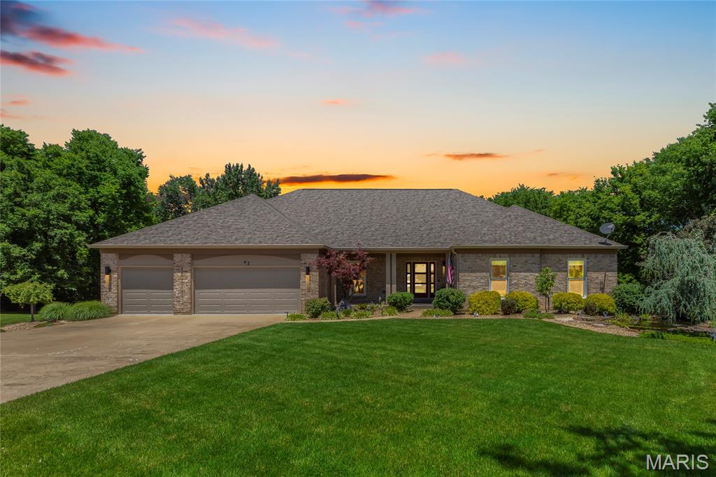 Set on a breathtaking almost acre lot, this impressive walk-out atrium ranch blends refined living with exceptional indoor and outdoor entertaining spaces. Offering 4 bedrooms, the thoughtfully designed layout includes 3 bedrooms on the main level and another bedroom in the lower level that is currently serving as a workout room.

The expansive main living area features built in shelving with lighting, Anderson windows, soaring vaulted ceilings and rich hardwood flooring, creating an inviting open feel perfect for both relaxing and gathering. The oversized primary suite features a peaceful retreat with a custom walk-in closet, an updated bathroom with newer cabinetry and gorgeous Brizo high polished chrome fixtures. The well-appointed kitchen combines functionality and charm with a center island, two pantries, and a spacious eat-in area designed for everyday living and effortless entertaining.

The finished lower level adds even more room to host with a dedicated bar area and flexible living spaces The icing on the cake is the movie room that offers even another entertaining space. Outdoors, the property transforms into a true backyard retreat with lush professional landscaping, a sparkling inground saltwater pool, low maintenance decking, a sprawling pool deck built for entertaining large groups, and a cozy fire-pit area perfect for evening gatherings. The roof, siding, garage doors and sunroom windows are all new. The sunroom, with Pergo flooring, offers a serene space to enjoy the scenic surroundings year-round.

Completing the home is a spacious three-car garage featuring durable epoxy flooring. From the stunning outdoor amenities to the warm and inviting interior, this property offers an outstanding blend of comfort, style, and entertaining potential. You have to see it to appreciate all the care and quality of this home! Schedule your showing now.