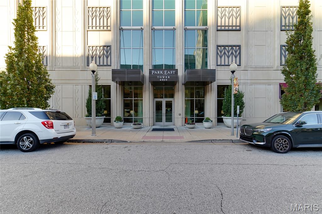 This stunning two-bedroom, two-and-a-half-bath condominium offers a rare blend of modern design, smart-home convenience, and breathtaking Forest Park views. With floor-to-ceiling windows and two private decks, natural light fills every room, highlighting the updated lighting throughout. The open-concept living and dining area features remote-controlled roller shades, a low-voltage lighting system, a striking five-pendant chandelier, and a 76-inch flush-mount SimpliFire fireplace with remote. Flush-mount rear speakers and a remote-controlled AV system, housed neatly in a closet, enhance entertainment options. Climate control is effortless with Nest thermostats managing two HVAC systems. The built-in office provides custom cabinetry, bookcases with USB charging ports, and accent uplighting above the shelving.

The remodeled 2023 kitchen is a chef’s dream, complete with a Sub-Zero refrigerator/freezer with ice maker, Thermador 36-inch Freedom induction cooktop, dual Monogram Statement ovens (30-inch and 27-inch) with Wi-Fi capability, and a Bosch 800 dishwasher. Oyster Antico honed quartzite countertops, Beck Allen soft-close cabinetry, a large pantry, and an oversized Franke stainless steel sink with a cutting board ledge make the space both functional and elegant. Additional features include extra island storage and a Sub-Zero dual-zone 146-bottle wine fridge, ideal for entertaining.

The primary suite, also remodeled in 2023, offers a serene retreat with power-operated room-darkening drapes and privacy sheers controlled by customizable remote. A 52-inch Big Ass high-tech ceiling fan with downlight adds comfort and style. The primary bathroom features a floating double-sink vanity with generous storage, new Kohler faucets, an extra-deep soaking tub, a separate shower, built-in ceiling speakers, and automated roller shades for privacy.

The guest suite, remodeled in 2025 and currently used as a home gym, includes a ballet barre, mirror, and automated roller shades. The adjoining bath showcases a Beck Allen floating vanity, frameless mirror with integrated lighting, terrazzo speckled tile flooring, a glass-enclosed shower with a rainfall showerhead, and an American Standard DXV SpaLet bidet toilet. The laundry room and half bath feature a custom-built storage closet, floating vanity, and a stacked oversized LG washer and dryer.

Smart-home features extend throughout the residence with a Lutron lighting system that controls all switches and dimmers via a mobile app, accessible from anywhere. Additional conveniences include an oversized parking space, walk-in storage unit, and dedicated bicycle storage. Combining luxurious finishes, thoughtful updates, and panoramic Forest Park views, this condominium offers exceptional comfort, functionality, and contemporary style in a premier location.