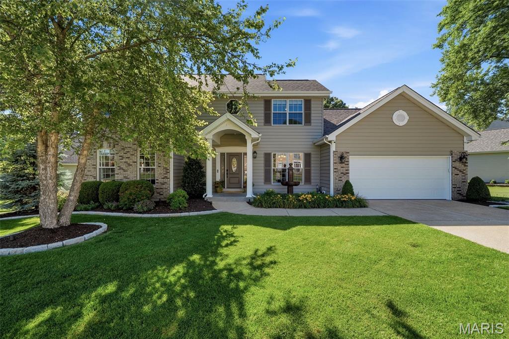 Welcome to the highly sought-after Arbor Oaks neighborhood in Ballwin! From the moment you arrive, you’ll be impressed by the charming front porch, custom brick mailbox, and meticulously maintained landscaping with outdoor lighting and an irrigation system for effortless upkeep. Inside, abundant natural light, warm hardwood floors, and impressive custom millwork create an inviting first impression. The dramatic entry opens to a spacious great room anchored by a gas fireplace and flows seamlessly into the breakfast room and updated kitchen. Designed for both everyday living and entertaining, the kitchen features beautiful Koch cherry cabinetry, stainless Wolf appliances, a Bosch dishwasher, generous counter space, and exceptional storage. The dining room is ideal for hosting, highlighted by custom lacewood window casings. Just off the kitchen, the main-floor laundry room offers additional storage, a utility sink, and convenient access to both the garage and deck. An updated powder room adds convenience for guests. The main-floor primary suite is a true retreat, featuring a spacious bedroom and an updated bath with double vanity, soaking tub, separate shower, heated floors, and a walk-in closet finished by St. Louis Closet Company. Upstairs, you’ll find three additional bedrooms with custom closet organization and a full bath. The walkout lower level is equally impressive, showcasing a large custom bar with Ambrosia Maple bar top, granite countertop, Cherry cabinetry, Bosch dishwasher, and custom stonework designed to display a liquor collection. A cozy home theater area, full bath with shower, and workshop and storage space complete the lower level. Outdoor living is just as exceptional, with a large patio featuring a wood-burning fireplace, a composite deck, and an aluminum fenced yard perfect for year-round enjoyment. Recent updates include siding, roof, garage door, skylights, additional insulation, and Pella wood windows. All of this, plus access to the subdivision pool, makes this home truly special!