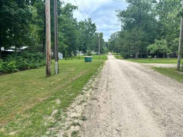 All wooded lot at Iron Mountain Lake with access to fishing , camping and close to several State Parks. Has access to all utilities.