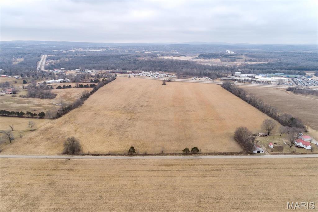 A unique blend of commercial development potential, with residential use as a secondary opportunity, and the charm of a working farm. Located just outside the city limits, it is ripe for annexation, unlocking possibilities for a variety of uses—including residential subdivision development. The land’s fertile soil and expansive pastures are perfect for haymaking, farming, or other agricultural ventures, with a Soil NCCPI score of 84, ideal for diverse crops and mini-farming. With Phase 1 electric at the road, future annexation gives access to water and sewer lines along the eastern boundary.
With its proximity to both elementary and high schools, and nearby attractions, such as a family fun center, it offers excellent entertainment options. Whether you envision building a commercial hub, a residential community, or subdividing into acreages or continuing the property’s farming legacy, this land is an ideal canvas. Make your vision a reality!