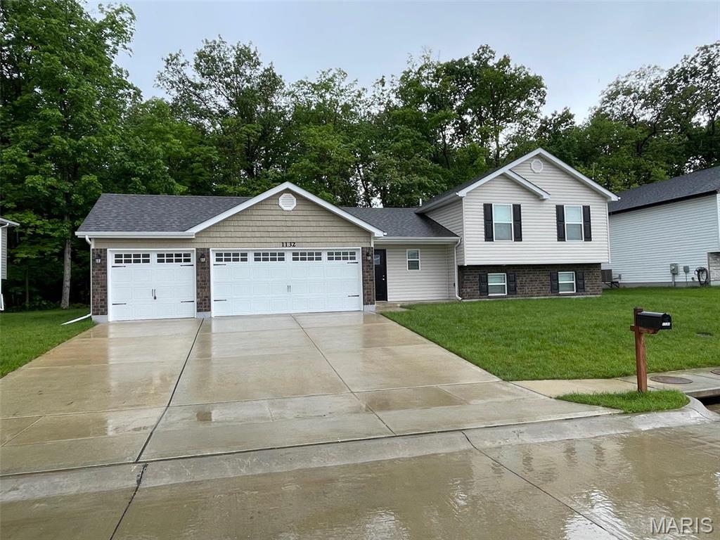 NEWER 4Bed/3Bath home backing to woods, with every upgrade you could imagine! They include vaulted ceilings, rounded corners, granite countertops, stainless steel appliances (including fridge), cabinets with "soft close", custom neutral colored paint job throughout, framed windows, taller baseboards, adult sized cabinets in bathrooms with marble countertops, walk-in closet, upgraded carriage doors on a 3-CAR garage with openers, panel interior doors, and upgraded water/light fixtures throughout the house! FINISHED Lower Level featuring 4th bedroom, and 3rd full bathroom! Tenant to verify school districts as Wentzville is undergoing constant change. (Agent Owner)