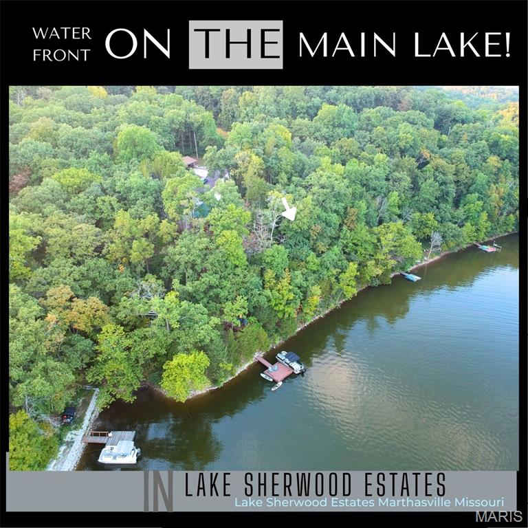 A stunning waterfront homesite in the 24-hour gated Lake Sherwood Estates awaits your dream home. Imagine starting each day sitting on your dock, enjoying peaceful views of Robin Hood Cove on the main lake, surrounded by privacy, lush greenery, and mature trees. Perfect for a walkout basement design, there's no set construction timeframe, though building guidelines and restrictions apply. The property, preserved in its natural state, offers over half an acre with 154 feet of road frontage and 113 feet of shoreline, ideal for a dock. The yearly taxes for 2025 are $161. Wildlife like deer, red foxes, bald eagles, and blue herons add to the charm. Ownership grants access to community amenities, even without building. Conveniently located, the property is minutes from Marthasville, Augusta, Foristell, New Melle, and Washington, and just a 35-minute drive from Chesterfield, near Missouri's top wineries.