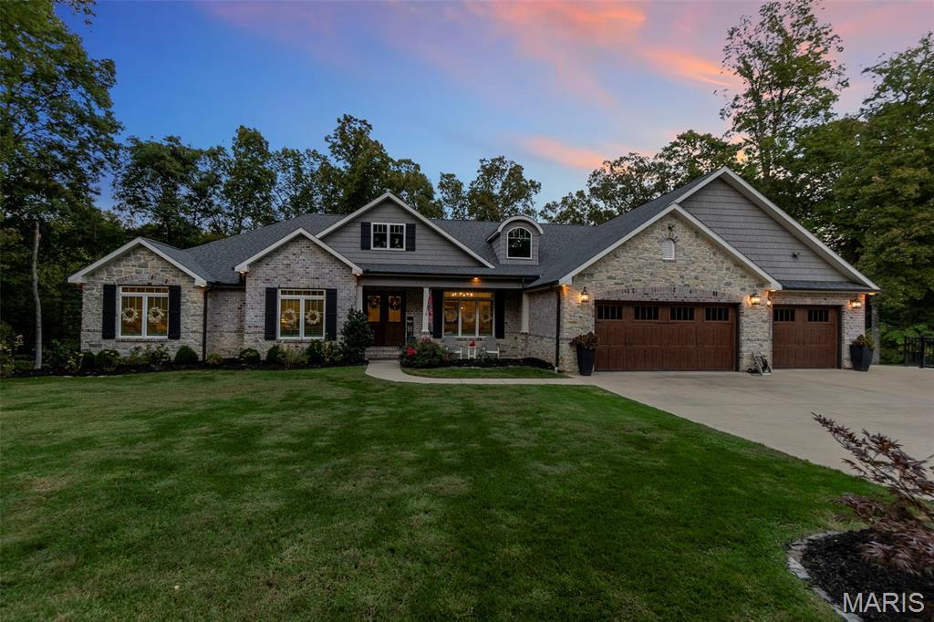 Beautiful all-brick estate set on 4 secluded acres in the Jackson School District, offering rare privacy on a quiet dead-end street. This expansive home boasts 5 bedrooms (with the option for a 6th), 4.5 baths and an oversized 3-car garage along with a lower-level John Deere garage. Featuring 5,400 finished square feet plus abundant unfinished space for future customization, the home is designed for both comfort and growth. The primary suite showcases dual walk-in closets. Energy-efficient features include dual HVAC systems, spray-foam insulation, and triple-pane windows, complemented by a covered deck ideal for outdoor living. Enjoy a newly added, resort-worthy swimming pool that is truly a private retreat.