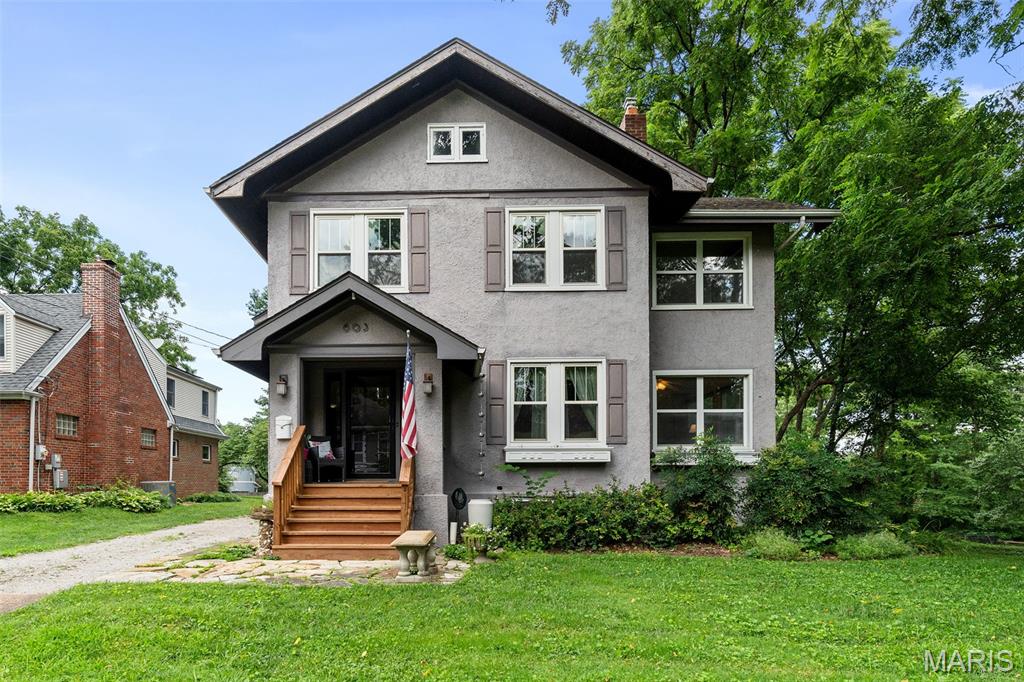 Nestled on a quiet, tree-lined street in Webster Groves, this charming 1920 Craftsman-style home offers the perfect blend of timeless character and everyday comfort. Imagine starting your mornings with coffee on the welcoming covered front porch before taking a short stroll to the boutiques, cafes, and restaurants of Old Webster. Inside, tall ceilings and abundant natural light create an inviting atmosphere throughout. The spacious living room is ideal for gathering with family and friends, while the separate dining room is ready to host holidays and celebrations for years to come. An updated kitchen, cozy breakfast nook, and sunroom provide beautiful spaces for everything from busy weekday mornings to relaxing weekends at home. Upstairs, you’ll find three comfortable bedrooms, an updated full bath, and an enclosed sunroom that offers endless possibilities as a home office, reading retreat, or creative studio. Step outside to the expansive back deck overlooking the oversized backyard, where there’s plenty of room for outdoor entertaining, gardening, pets, or simply enjoying peaceful evenings beneath the trees. Perfectly positioned just minutes from I-44, I-64, and all that St. Louis has to offer, this exceptional home combines the convenience of ideal location with the warmth of one of the area’s most beloved neighborhoods. Located in the highly acclaimed Webster Groves School District, this is more than a home—it’s an opportunity to embrace a lifestyle defined by community, walkability, and enduring charm.