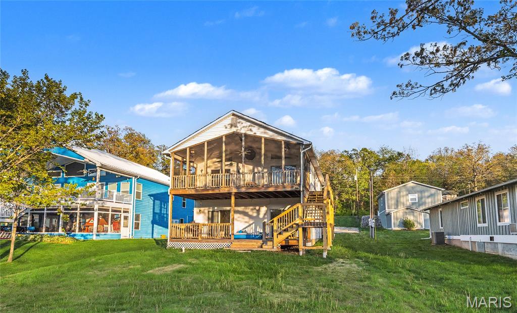 UPDATES THROUGHOUT!  Freshly painted throughout the home. New luxury vinyl flooring in living areas and hallways on both levels. New exterior stairs leading to entry from front or back of home. FULL septic system replacement! Located on sought after cove 7, the largest cove on lake. Private dock w space for table & chairs and boat slip ready for fun!
4 spacious beds, 2 full baths. 2 on the main level & 2 on the lower (walkout) level. Family room space on the main floor & lower level. Fireplace on the main. Spacious kitchen w adjoining dining room. Open floorplan for gatherings & entertainment. Dedicated laundry room on the lower level. Wonderful screened in deck across the back of the home on the main level. Awesome water views. Large oversized 2 car garage attached (current owners easily winter store their pontoon, jet ski and lawn equipment)
Enjoy boating, fishing, floating, skiing, tubing & jet skis on the 326+/- lake. Community center for social gatherings w sandy beach, pickleball courts, tennis, horseshoes, and basketball. Playground for kids to Enjoy. Full service marina within the community! Gated community. 
A little over an hour from the Saint Louis area. Home to be sold furnished. Pontoon, jet ski can be purchased separately.