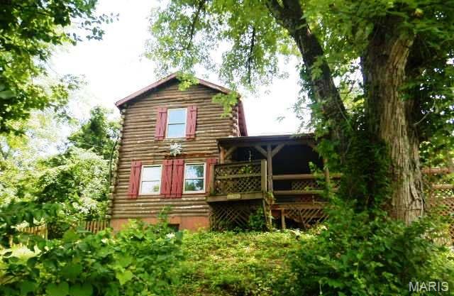 1.5 story log cabin style home situated just under one acre. Attached two car garage, tuck under two car garage and more. Needs a renovation but priced accordingly Great opportunity, so much character and charm. Needs some repairs and upgrades. Make this homes your today!

Buyer to Verify all information and mls data.