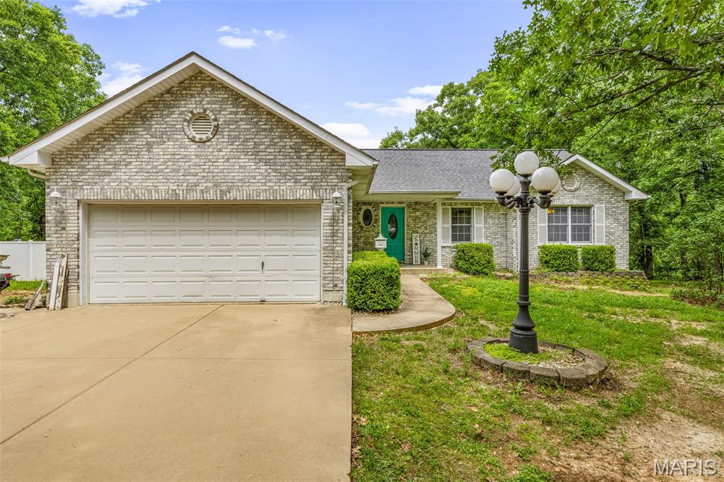 Looking for acreage in an unrestricted neighborhood with an inground pool? This ranch-style home offers 3 bedrooms, 4 baths, an open floor plan with vaulted ceilings, beautiful custom wood flooring throughout the main level, main floor laundry, and a spacious primary suite with an ensuite bath and walk-in closet. Enjoy the wooded views from your screened-in rear porch! The lower level offers the additional sleeping room oerfect for an office or guest space, full bath, wet bar, and plenty of extra storage space. An oversized attached 2-car garage, oversized carport, and beautiful 3.5-acre setting make this home an incredible opportunity! Seller is also willing to give a 2 year Home Warranty as well at closing!