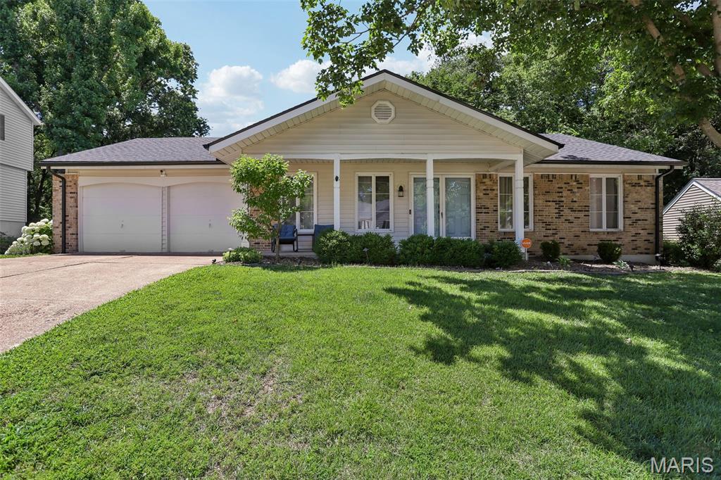 Welcome home to this spacious and inviting ranch in the heart of Manchester! From the moment you pull up, the lush landscaping, 2-car attached garage, and undeniable curb appeal set the tone, and just wait until you see the backyard. Step in from the covered front porch into a practical entry foyer leading to a large living room and formal dining space, all framed by gleaming hardwood floors throughout. The eat-in kitchen is ready for everyday life and weekend pancakes alike, featuring newer stainless steel appliances (all included!), a handy pantry, and a sunny breakfast area. Retreat to the serene primary suite, complete with an updated bath and a big window that frames a beautiful view of the yard. Two more comfortable bedrooms, plus a beautifully updated hall bath round out the main floor. Downstairs, the finished lower level adds a wealth of extra living space with a recreation room and a bonus den, a 3rd full bath, a 4th bedroom, a huge and functional laundry/hobby room, and plenty of storage to spare. Now for the showstopper: step out back to a patio, deck, and fire pit just begging for s'mores and summer evenings, with loads of room for kids to run and play. With arguably one of the best lots in the neighborhood, this large, flat backyard is a true dream for pets and people alike. And the location delivers too, with an active community, easy access to everything, and award-winning Parkway School District. More to love: a brand new architectural roof, newer HVAC, and thoughtful updates throughout. This one is truly special, and it won't last long. Come see why it's the one!