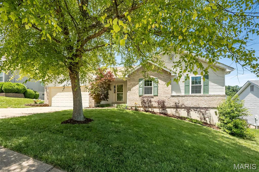 Welcome home to 1167 Winter Park Dr, where modern style meets total comfort. From the moment you step inside, you’ll notice the fresh, contemporary feel created by the new LVP flooring, neutral color palette, and updated light fixtures that brighten every room.

The heart of the home is a stunning vaulted great room, anchored by a gas fireplace with a crisp white mantle—the perfect spot for cozy evenings. Transition easily into the kitchen, a home chef’s dream featuring stainless steel appliances, a stylish tile backsplash, and a massive walk-in pantry that ensures you’ll never run out of storage. For added convenience, the main floor laundry is tucked away right where you need it.

Retreat to the primary suite, a true sanctuary boasting new carpet, a spacious walk-in closet, and a beautifully updated bath. You’ll love the 6-foot adult-height vanity, new flooring, and the fresh tub and shower surround. The hall bath has been equally refreshed with an adult-height vanity and commode, ensuring guests and family are just as comfortable.

The living space doubles in the walk-out lower level! This versatile footprint includes a huge rec room with custom built-ins, a private den for your home office, an additional bedroom, a full bath, and plenty of extra storage.

Outside, the lifestyle continues on the oversized deck and concrete patio, all overlooking a large, fully fenced backyard—ideal for summer BBQs or letting the dogs run. Situated in a prime location, you’re just minutes away from local schools, parks, and the best shopping and dining in the area. This one is move-in ready and waiting for you!