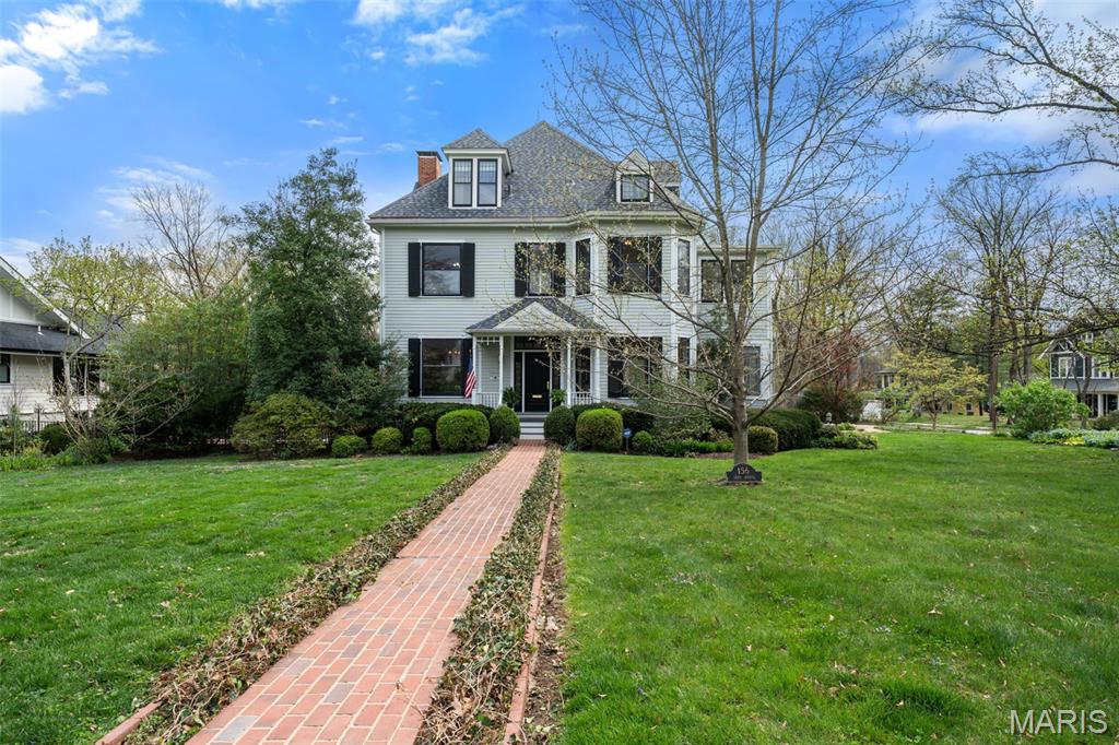 Step into this historic Webster Groves home boasting over 4,500 + sq ft, where timeless design meets modern amenities. You’ll be welcomed by a beautiful entry foyer, with dining and living rooms flanking either side, a sunroom and office. In addition you’ll find a spacious kitchen with island that opens to a hearth room with gas fireplace and breakfast room. The main floor plan is versatile for any style of living and also includes an elevator, front & back staircases, a mud room/pantry with sink, powder room, 10-foot ceilings and newer wood floors. 
Upstairs the primary suite is it’s own retreat, featuring walk in closets, stackable laundry, luxury bath and elevator access. It is joined by 3 more bedrooms, 2 add’l full baths, sunroom and 10’ ceilings. The 3rd floor boasts in size with a rec room with built ins, 5th bedroom, 4th full bath and 9’ ceilings. Enjoy your own private oasis with a heated in-ground pool, amazing gardens, brick patios and a covered veranda off the hearth room. All of this just steps away from shops, schools, restaurants, and energy of downtown Webster Groves, one of St. Louis's most beloved neighborhoods. 
*Features sheet will be downloaded along with sellers and pool disclosures. *No show until AOH 4/7/26.