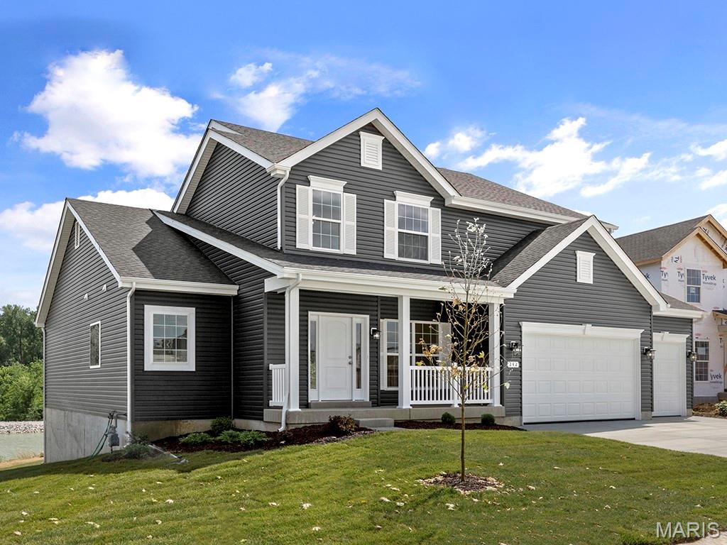 New McBride Homes Pin Oak 1.5-story luxury home with 4 BR, 3.5 BA, ready this winter! Expanded floorplan w/3 CAR GARAGE! Enjoy a 2-story great room w/floor-to-ceiling window wall, 9’ ceilings, 6’ windows, & wood laminate flooring. The Gourmet kitchen features Winstead Burlap 42” cabinets, large island, quartz counters w/backsplash, GE stainless appliances, & double oven. Formal dining room & powder room included. Main-level primary suite w/walk-in closet & luxury bath w/ tub, shower, double vanities & water closet. Upstairs has a Jack & Jill bath between BRs 1 & 2, & a private bath for BR 3. Extras: dual-zone HVAC, spindled staircase, matte black fixtures, 2-panel doors, main floor laundry and more! Regal Pines offers beautiful new homes in Ellisville with convenient access to shopping, dining, parks, and major highways for easy commuting throughout St. Louis County. Enjoy peace of mind with McBride Homes’ 10 year builders warranty & incredible customer service! Similar photos shown.