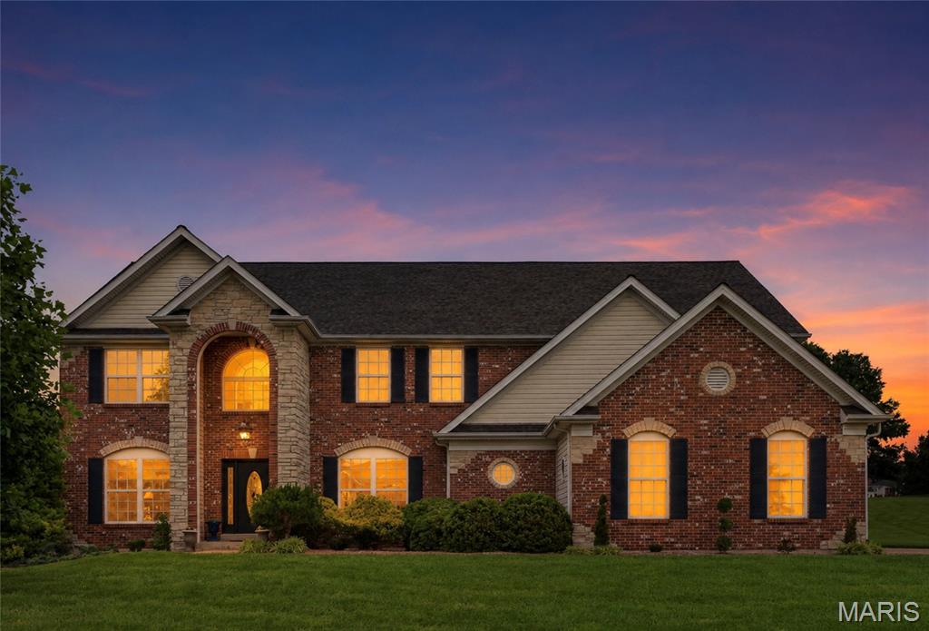 Located in one of the area’s most prestigious and highly sought-after neighborhoods, this exceptional brick-and-stone home offers an unmatched combination of elegance, privacy, and lifestyle. Gracefully set on a private one-acre lot within a quiet double cul-de-sac, the home is located in the prestigious Camelot community, known for its scenic lakes and winding walking trails. Inside, rich oak hardwood floors and detailed millwork create a warm yet sophisticated atmosphere. The designer kitchen, featuring 42-inch cabinetry, granite countertops, a generous center island, and a planning center, serves as the heart of the home, designed for both everyday living and gracious entertaining. The sun-filled breakfast room opens through French doors to the patio and pool, offering effortless indoor-outdoor living throughout the seasons. Outside, the resort-style pool is thoughtfully equipped with remote-controlled features, including lighting, a fountain, and an automatic vacuum system for easy maintenance and elevated enjoyment. A basketball hoop near the stair area adds an extra touch of recreation and fun to the outdoor space. The dramatic great room showcases a wall of windows and a marble fireplace flanked by built-ins, creating a welcoming space to gather. A private study provides flexibility for a home office or guest suite. The coffered primary suite is a true retreat, complete with its own fireplace, an expansive 14-foot walk-in closet featuring a built-in coffee bar and cabinetry, and a spa-inspired bath with dual vanities and a jetted tub. The finished lower level expands the home’s versatility with a recreation room, gathering bar, and additional accommodations, including a full bath, ideal for hosting, relaxing, or accommodating guests. Set within a neighborhood celebrated for its tranquil lakes, walking paths, and strong sense of community, this home offers not only luxury, but a lifestyle defined by connection, comfort, and prestige.