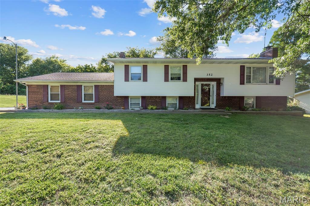 Located just beyond the Cape Girardeau city limits on more than half an acre, this 4 bedroom, 2 bath home delivers the space and lifestyle your family has been looking for. Step out onto the sun porch and take in the view — a lush, park-like backyard complete with an above ground pool, a gorgeous partial wrap-around deck, and a storage shed ready to house everything from lawn equipment to pool gear. Inside, the living room includes a wood burning fireplace, while the lower level adds bonus space — a generous family room warmed by a wood burning stove, a full bath, ample storage, and a bonus room. The family room connects directly to an oversized 2-car garage, making everyday living incredibly convenient. Quiet neighborhood, great curb appeal, and more room than you'd expect — this one checks a lot of boxes. Call us today to view!