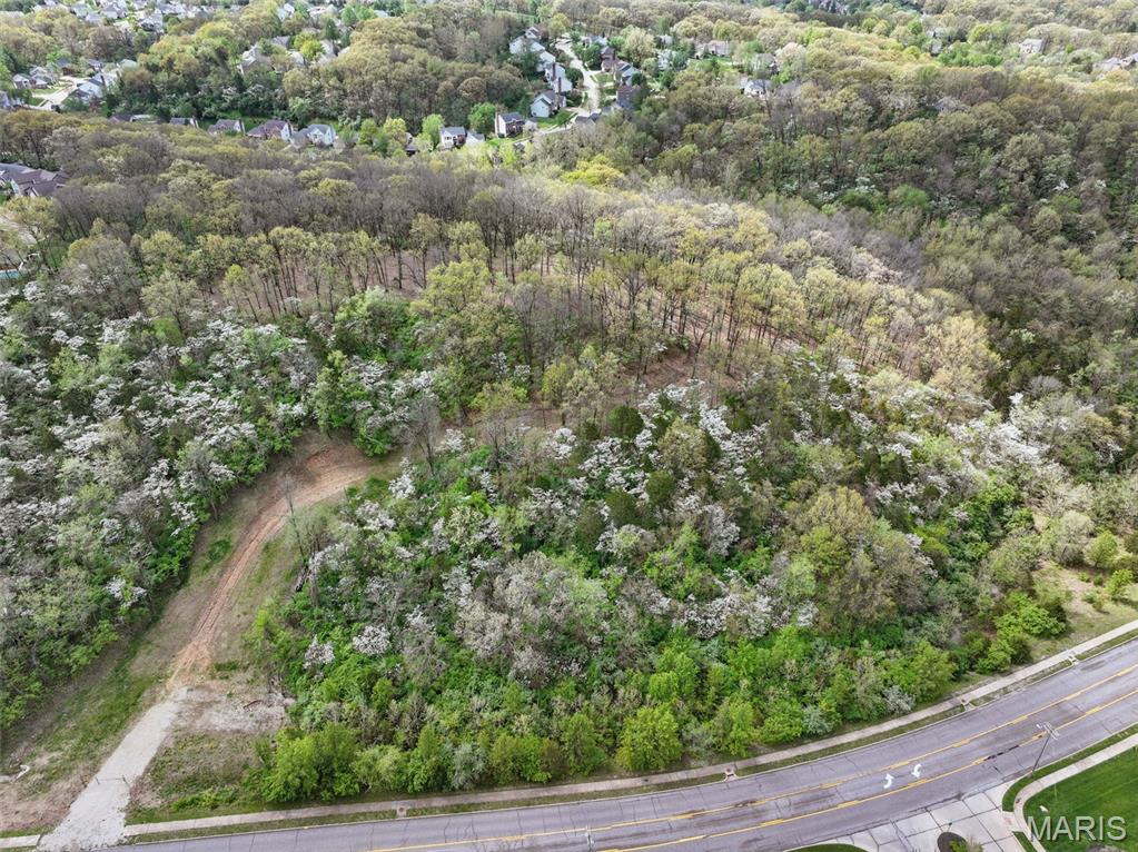 An extraordinary opportunity awaits on this breathtaking 18+ acre hilltop estate site, an unparalleled setting where privacy, elevation, and panoramic vistas come together to create a truly remarkable canvas for your dream retreat.
Set at the end of a winding drive already cut into the landscape, the approach alone sets the tone: secluded, serene, and undeniably grand. The partially cleared homesite sits perfectly positioned to capture sweeping views in every direction, offering limitless potential for an architectural statement worthy of its surroundings.
Much of the groundwork has already been completed. A new driveway apron and previously approved plans from MODOT, St. Louis County, and the City of Wildwood, along with utility access, geotechnical studies, and a Phase I Environmental Study, provide a rare level of readiness for a parcel of this scale. Utilities are available, permits can be obtained, and the essential due-diligence elements are already in place, streamlining your path from vision to construction.
Whether your dream is a modern sanctuary of glass and steel, a timeless stone manor, or a private multi-structure compound, this exceptional property offers the foundation to bring it to life.
Secluded, stunning, and rich with possibility — your legacy estate begins here.
Watch the video to experience the beauty of this remarkable parcel