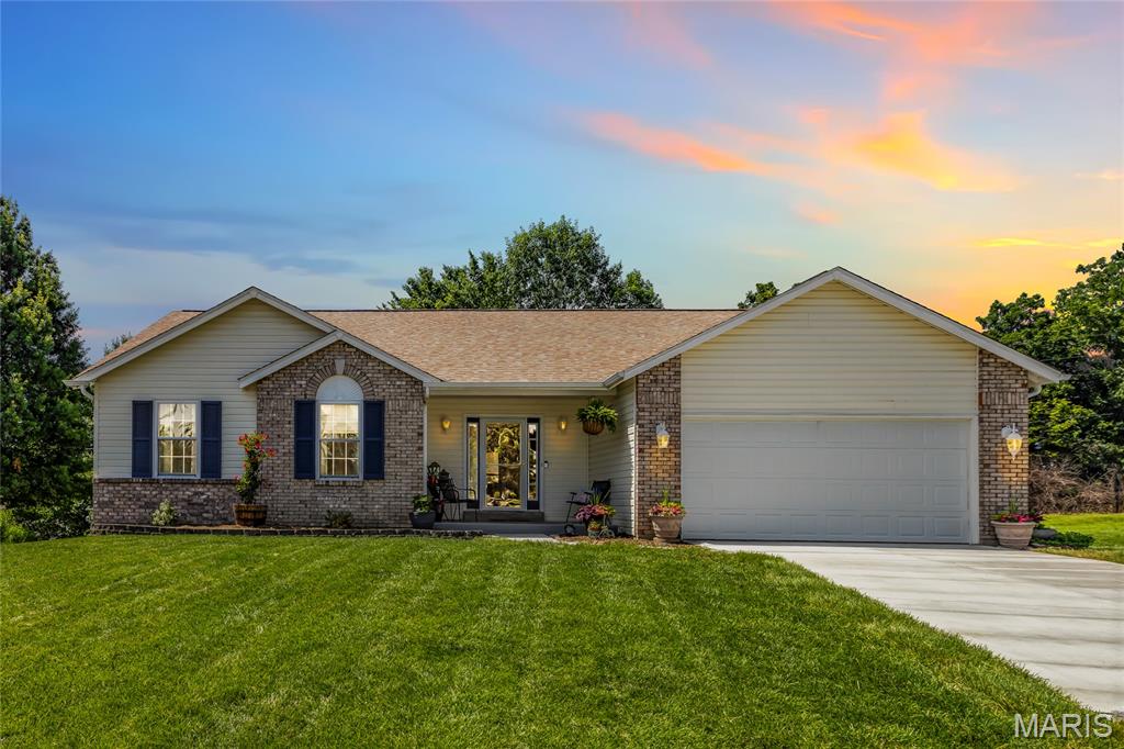 Open Sat, 6/13, 12-2pm. Tucked at the end of a quiet cul-de-sac in the Francis Howell Central school district, this home offers something that's getting harder to find: a place where everything has already been taken care of, so you can simply settle in and live.

The open floor plan sets an easy rhythm from the moment you walk in. Living, dining, and kitchen spaces flow together naturally, making the home feel connected whether you're hosting friends or enjoying a slow Saturday morning. Fresh interior paint (2025) and new carpet throughout the bedrooms and stairs (2026) give every room a clean, move-in-ready feel.

The eat-in kitchen anchors the main level with ample cabinet space and a breakfast bar that quickly becomes the spot where everyone gathers; homework, coffee, conversation. Main floor laundry keeps daily routines simple.

Three bedrooms include a large primary suite designed as a true retreat, with a walk-in closet, soaking tub, and separate shower. Two additional main-level bedrooms offer comfortable space for family, guests, or a home office.

Downstairs, the finished walk-out basement adds a whole second layer of living. A large rec and bar area is ready for game nights and gatherings, while a separate flex room adapts to whatever you need: exercise space, craft room, or a quiet spot for overnight guests.

Outside, the freshly stained deck overlooks a peaceful backyard with fresh landscaping, and new concrete pad from the deck (2026) make the transition to the yard seamless. Spend your days gardening, hosting BBQ's or relaxing in your backyard. Electrical has already been run for a hot tub, with roughed-in conduit from the basement to the exterior for future projects.

The big-ticket items are done, too: new roof (2025), HVAC (2024), water heater (2022), new driveway and walkway (2026), and new rear gutters (2026). This is a home that's been genuinely cared for and it shows in every detail.