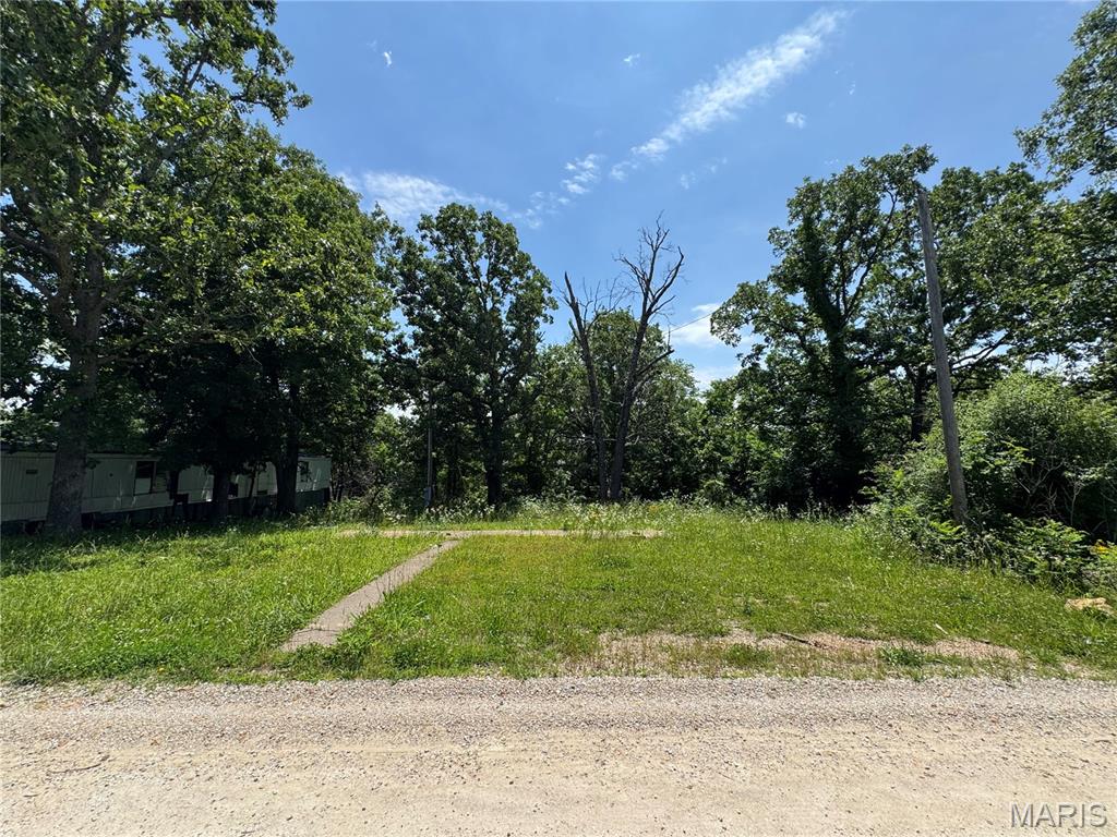 Opportunity awaits with this versatile 0.27 +/- acre residential lot featuring public water, public sewer, and electric already on the property. Mobile homes are permitted, making this an excellent option for mobile home placement or future homesite. Buyers & buyers agents are encouraged to perform their own due diligence regarding the condition and suitability of all improvements, utilities, zoning, lot boundaries & subdivision restrictions if any. Conveniently located in between St. Robert & Dixon Missouri and ready for your vision to take shape.