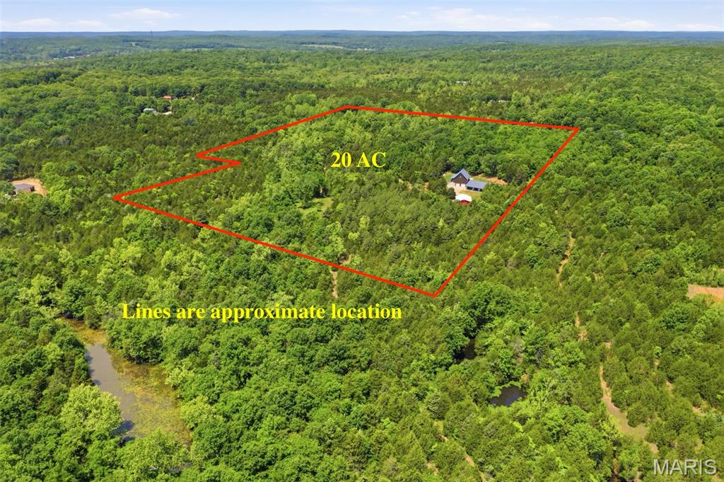 20-Acre Sustainable PRIVATE Paradise: Dual Residences & Massive Shop!
Don’t miss out on this incredible 20+/- acre piece of paradise! A new survey will be completed prior to closing, and if you are looking for even more room to roam, additional acreage is available—just ask for details!
This unique estate features a dual-residence layout perfect for multi-generational living, a premier hunting retreat, or a high-yield Airbnb investment. The primary residence is a custom 2000 sqft Earth Home built in 2019, offering unmatched energy efficiency and storm peace of mind. Connected via an above-ground concrete walkway is a secondary structure featuring a full basement/tuck-under garage with stairs leading to the roughed-in 1,650 sq. ft. cabin above. The cabin is a blank canvas featuring stunning cedar walls and vaulted ceilings, a 1,200 sq. ft. main level (2BR/2BA), and a 450 sq. ft. upper loft—just waiting for your finishing touches!
The park-like grounds are a dream for outdoorsmen, featuring a manicured trail system. Infrastructure is top-tier, including a full basement under the second structure with a two-car tuck-under garage and additional storage, plus a separate 30x40 detached garage that is fully insulated with concrete floors and electric. Ultimate reliability is provided by a 36KW Generac whole-home generator and a solar-powered security gate. Whether you want to hunt or live off the grid in luxury, the opportunities here are endless!