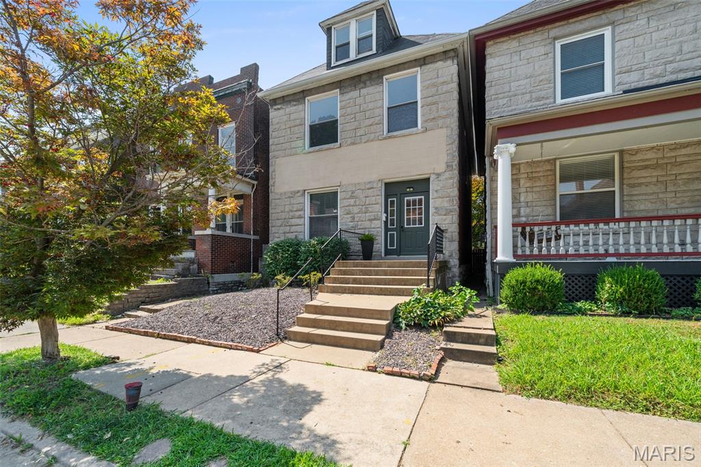 Rare opportunity to own a beautifully maintained duplex in the heart of Shaw, offering exceptional flexibility for both owner-occupants or investors. The expansive upper residence spans the second and third floors, living more like a single-family home with an open, inviting layout. It features three spacious bedrooms plus a large walk-in closet with the potential to become a fourth bedroom, home office, den, second bathroom, or laundry room. A striking three-quarter-turn staircase connects the living spaces, leading to an updated full bath with a tiled shower, an attractive renovated kitchen, and generous living and dining areas. The main-level furnished 1 bedroom apartment offers a bright, flowing floor plan with hardwood floors, living room, dining room with day bed for flexible additional guests, an updated kitchen, and a renovated bathroom—making it equally appealing for short-term tenants or an owner seeking one-level living. Each unit enjoys its own private rear deck overlooking the fenced backyard, creating inviting outdoor space for relaxing or entertaining. Located just blocks from the Missouri Botanical Garden and Tower Grove Park, you'll love easy access to Food Truck Fridays, the renowned Tower Grove Farmers' Market, neighborhood restaurants, and all that one of St. Louis' most sought-after neighborhoods has to offer. All appliances for both units are included, making this truly a move-in-ready, turnkey investment.