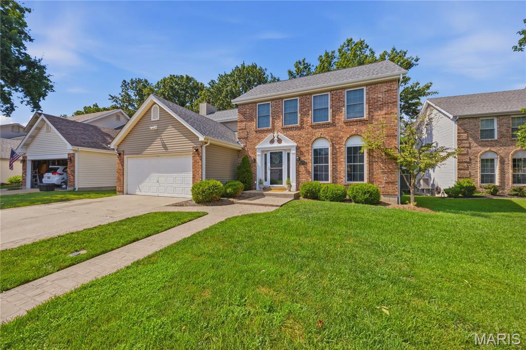 Nestled in a peaceful, sought-after Ballwin neighborhood, this timeless 4-bedroom, 2.5-bathroom home offers the perfect blend of space, comfort, and top-tier location. The main level welcomes you in with a formal dining room and a custom eat-in kitchen. The family room hosts a wood-burning fireplace, built-in bookshelves, and a scenic bay window creating a warm, inviting space.

Through the back door lies a beautifully level yard featuring a large, stamped concrete patio, ready for crisp autumn nights by a fire pit or summer dinners outside. Upstairs, the primary suite offers a quiet escape alongside three additional spacious bedrooms as well as an additional full bathroom. The lower level is ready for modern life with a large recreation room and an office perfect for remote work. With a new roof (2024) and enrollment in the prestigious Rockwood School District, this home is ready for its next chapter.
